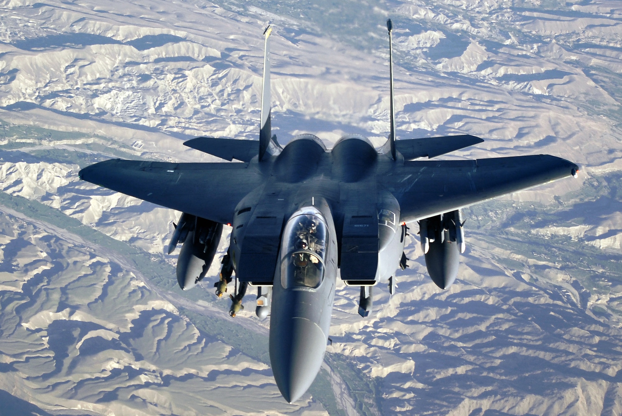 An F-15E Strike Eagle soars over the mountains and high desert of Afghanistan deterring enemy activities. The F-15Es perform shows of force and provide close-air support for International Security Assistance Force ground operations. (U.S. Air Force photo/Master Sgt. Lance Cheung)