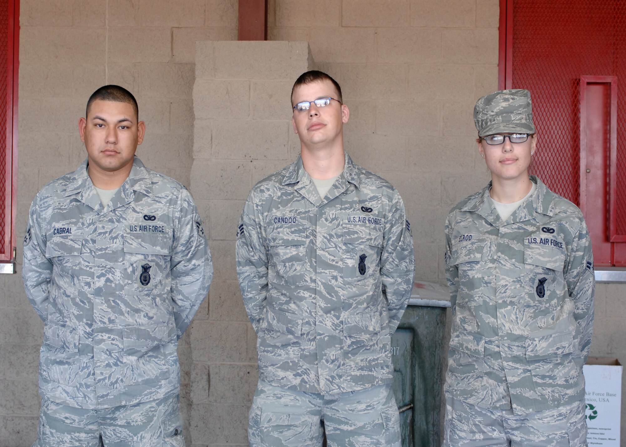The 49th Security Forces Squadron welcomes back three of its members, Senior Airman Andres Cabral, Senior Airman Ross Candoo and Airman 1st Class Jamie Elrod, Feb. 9, at Holloman Air Force Base, N.M. The Airmen returned from a 179-day deployment to Iraq. (U.S. Air Force photo/Airman 1st Class Rachel A. Kocin)