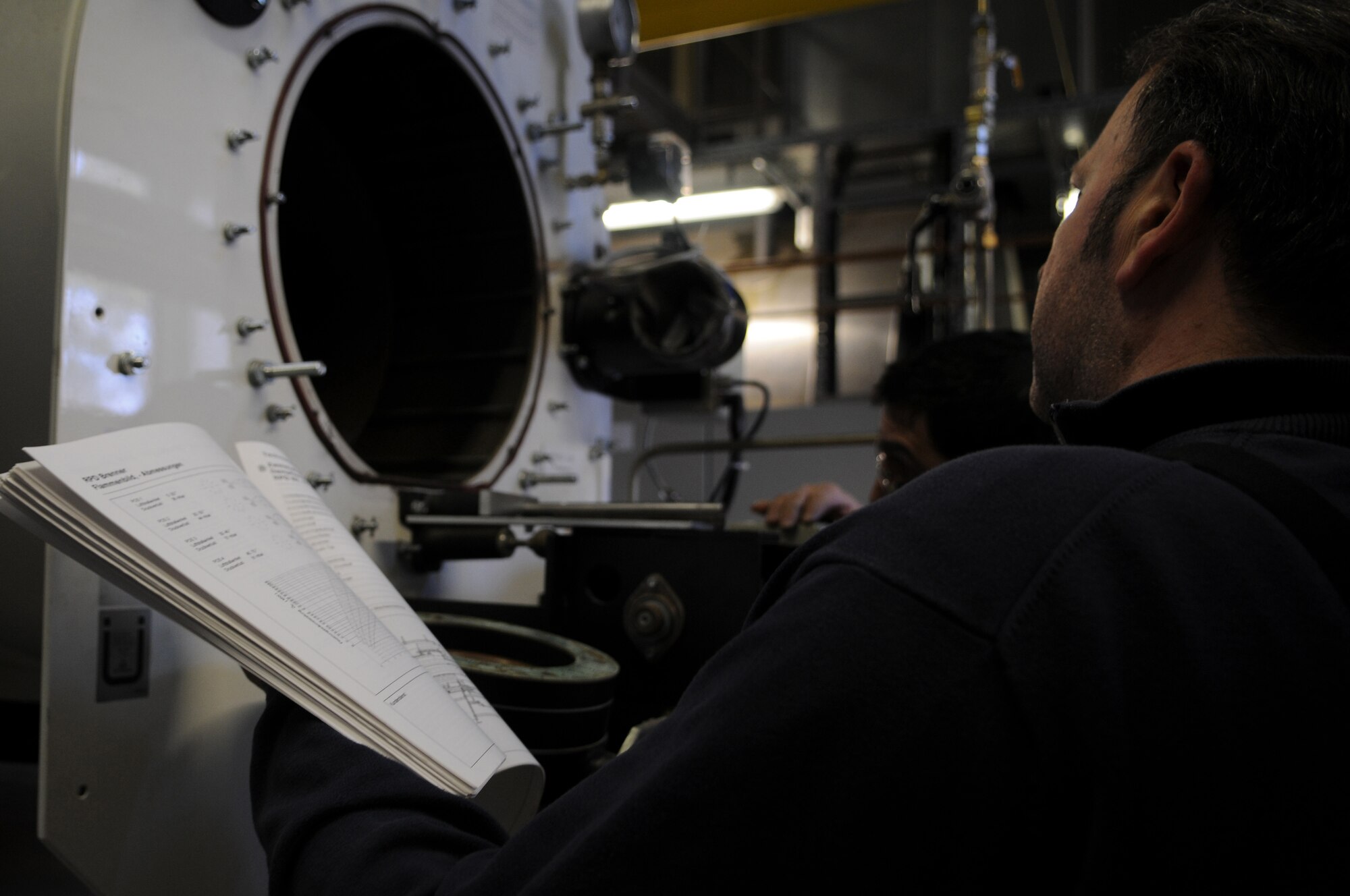 Mathias Barz performs a bi-annual inspection on a heating burner in Heat Plant One that was disassembled Feb. 12, 2009, at Ramstein Air Base. The heat plant has been supplying heat to the buildings of Ramstein since 1997 and continues to help support the mission. (U.S. Air Force photo by Airman 1st Class Caleb Pierce)