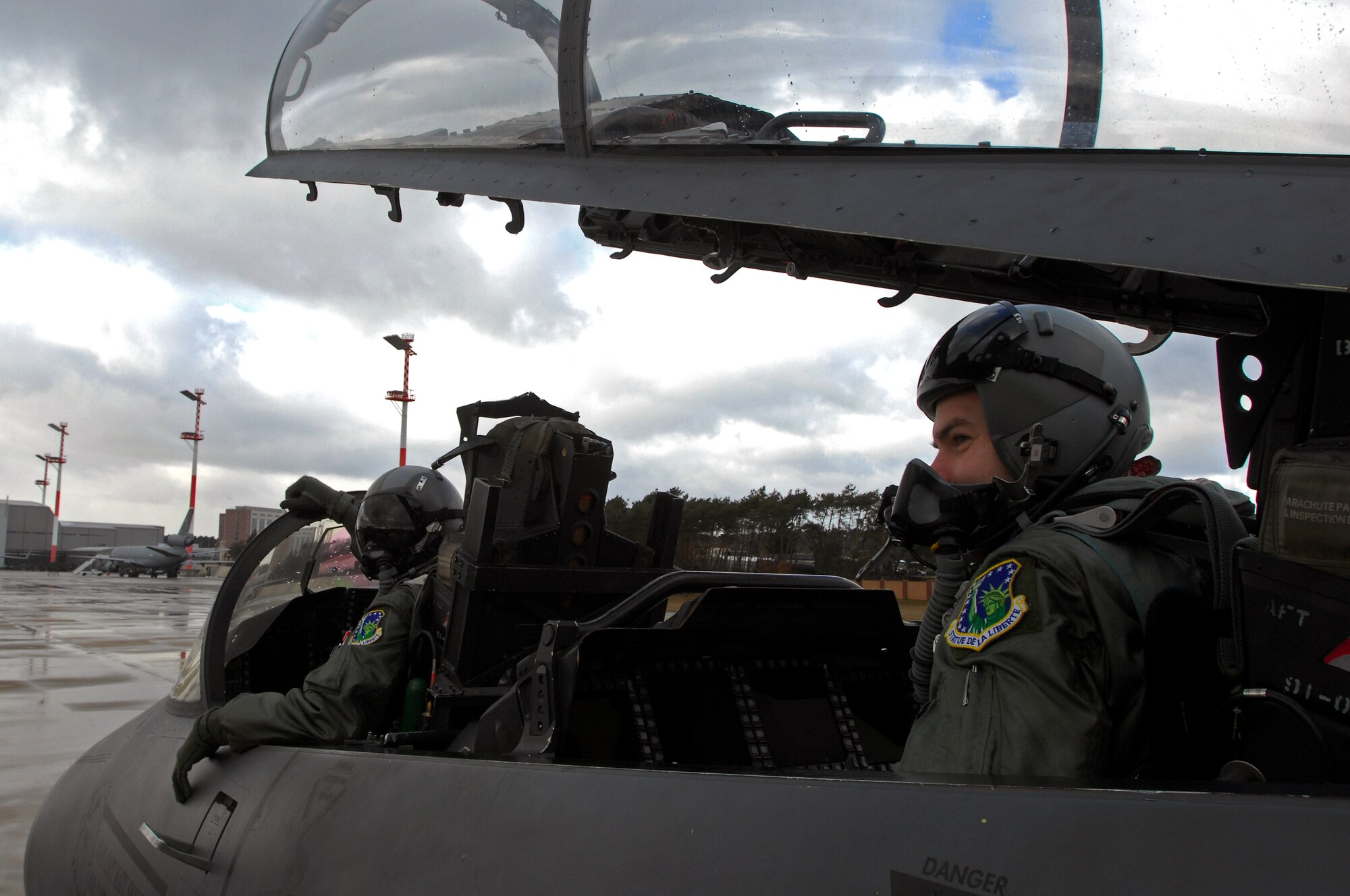 Capts. Matt Swanson and Alain Martinez, 48th Fighter Wing F-15E Strike Eagle pilots from Royal Air Force Lakenheath, England, strap in prior to take-off Feb. 12, 2009, at Ramstein Air Base. (U.S. Air Force photo by Airman 1st Class Kenny Holston)