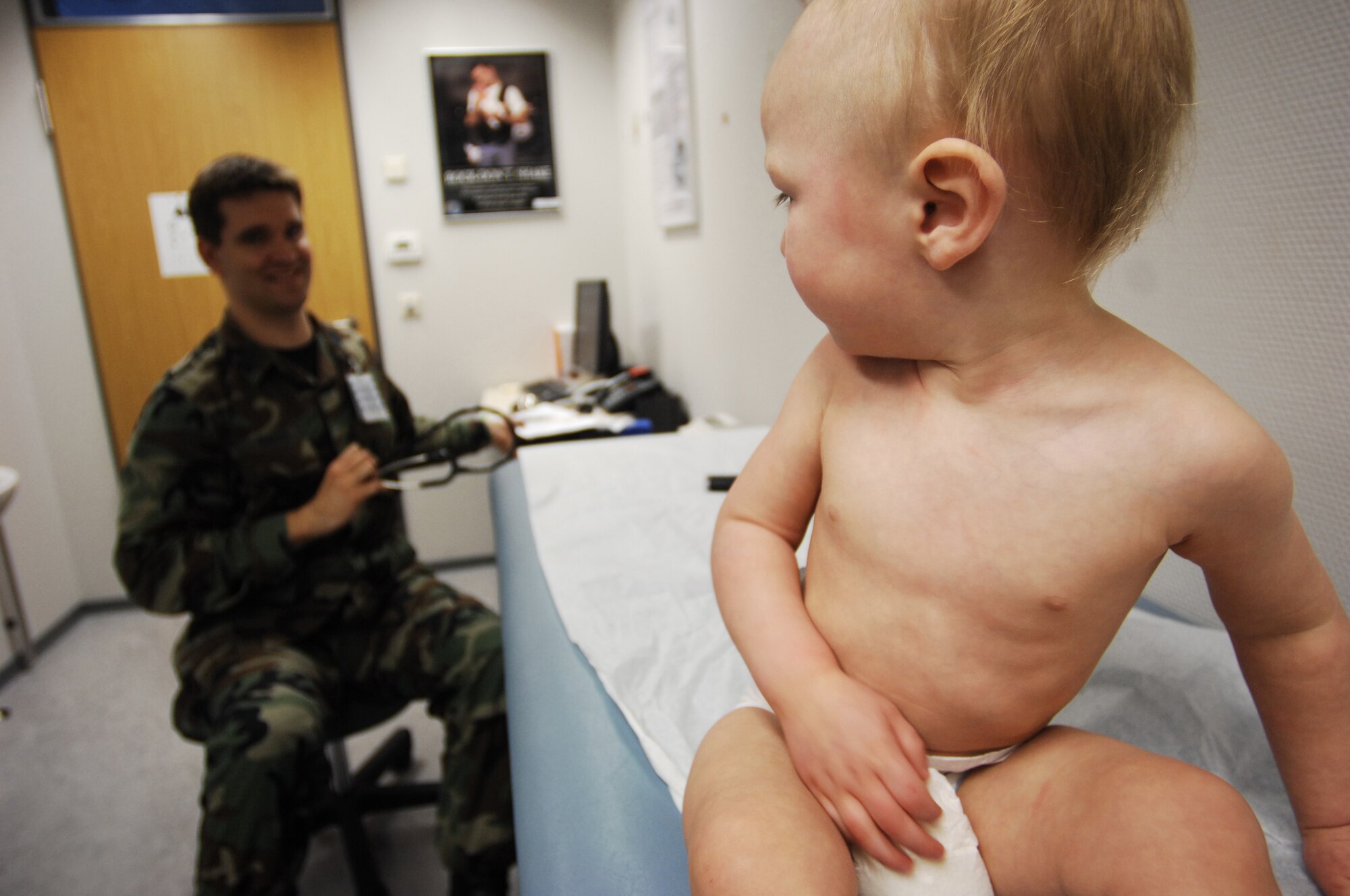 Capt. Christopher Rouse, 435th Medical Operations Squadron director of pediatrics, does a routine check-up on Christian Bressler, 18-month-old infant, Feb. 11, 2009, at Ramstein Air Base. The 435th MDOS annually processes about 15,000 appointments and treats an average of 4,800 patients. (U.S. Air Force photo by Senior Airman Amber Bressler)