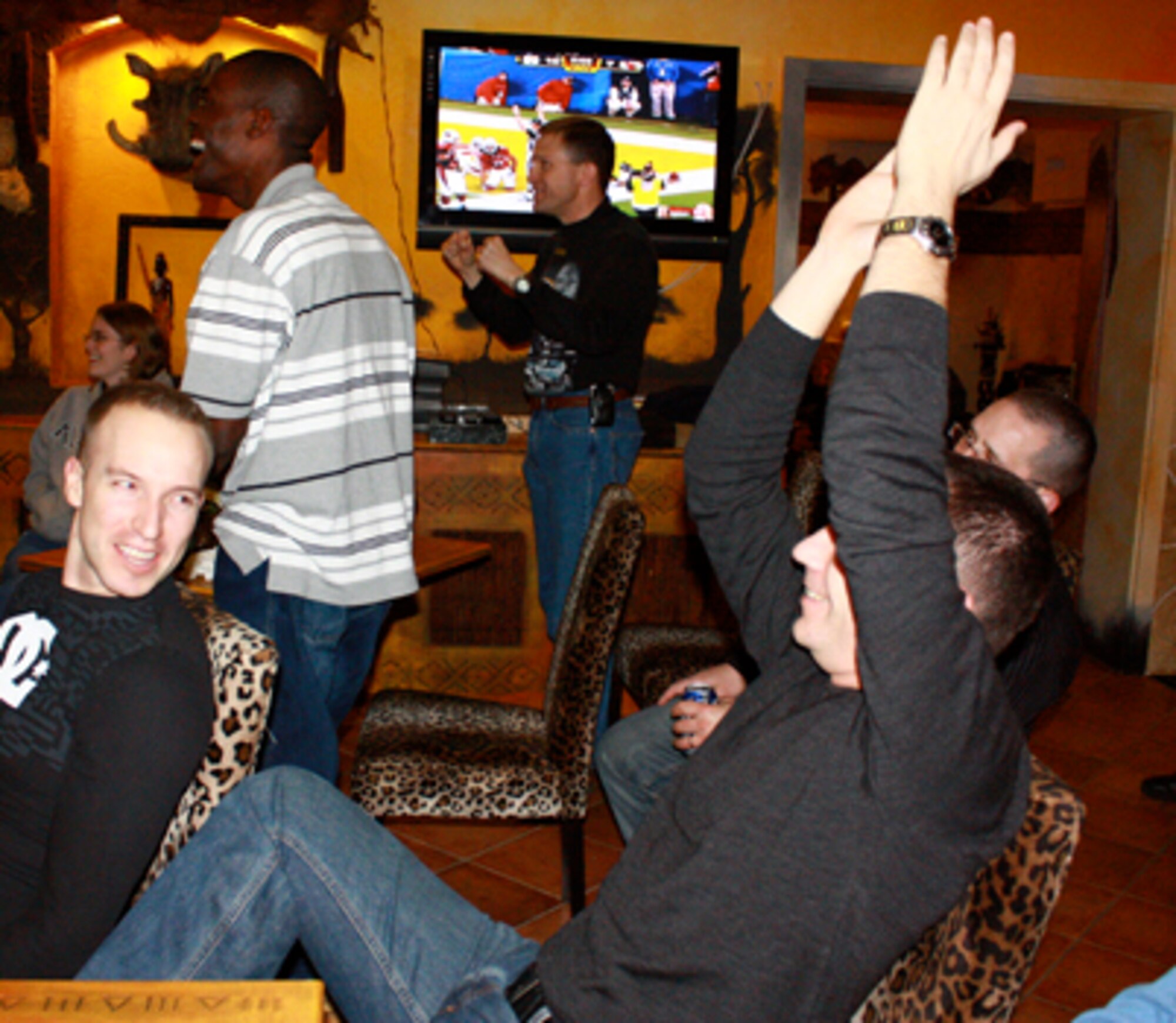 Multinational forces enjoy the Super Bowl at the Heavy Airlift Wing at Pápa Air Base.