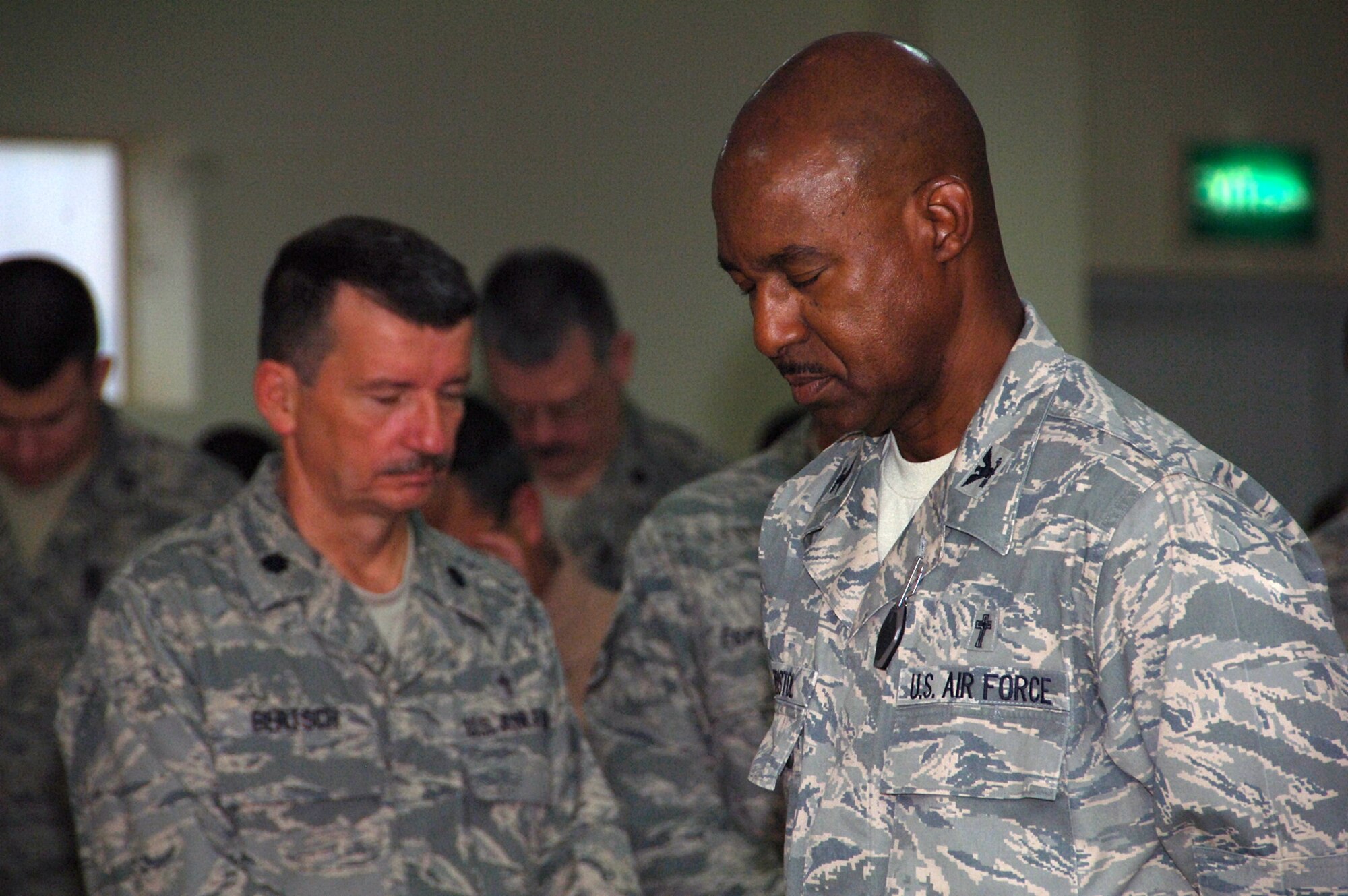 SOUTHWEST ASIA -- Chaplain (Col.) Wilfred Bristol, Air Forces Central command chaplain, prays with members of the 386th Air Expeditionary Wing before the National Prayer Breakfast at the Rock Chapel Feb. 17. (U.S. Air Force photo by Senior Airman Courtney Richardson)