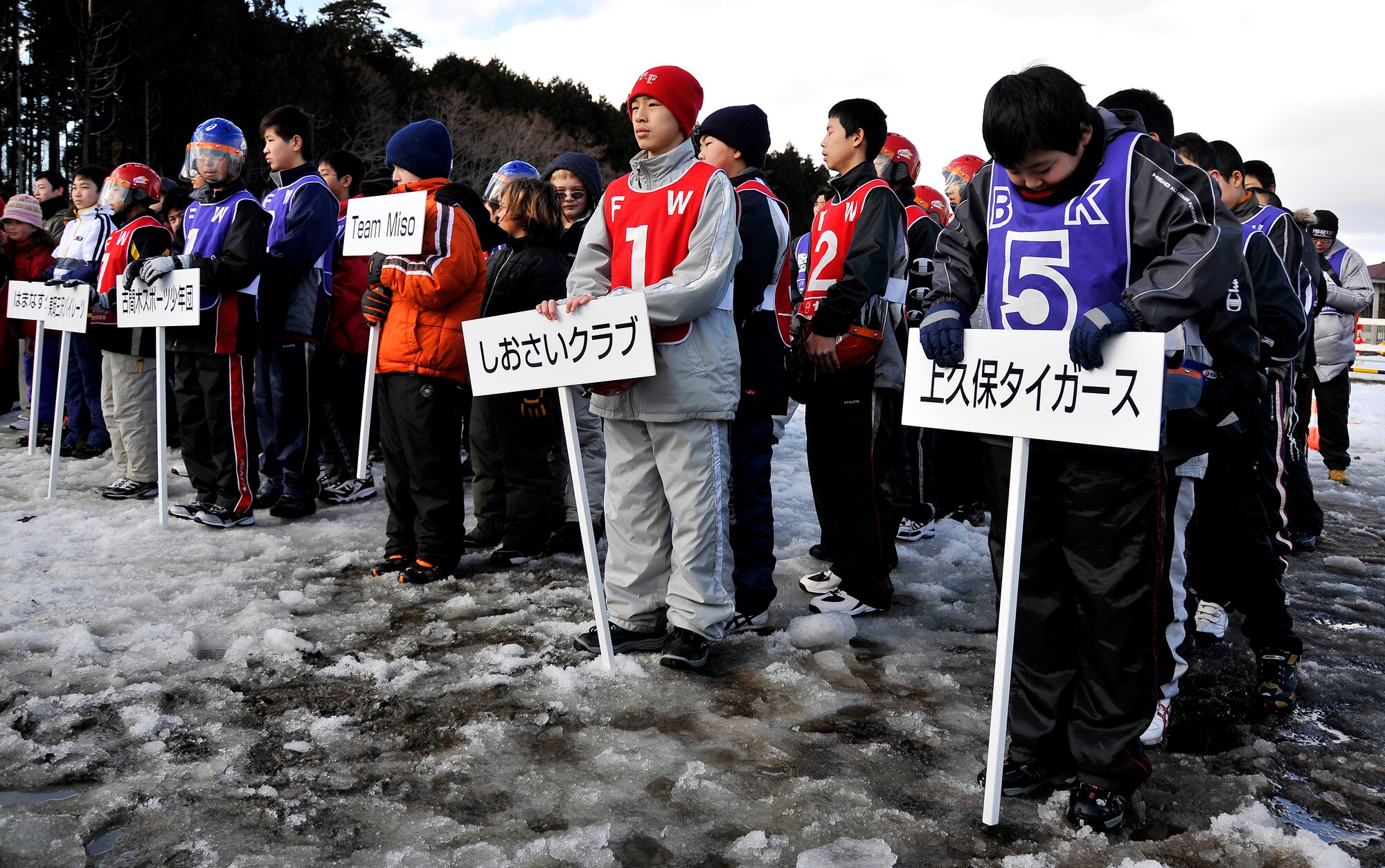 MISAWA AIR BASE, Japan -- Teams of children line up before taking the field during a snowball fight competition Feb. 14, 2009, in Misawa City. Five Japanese and three American teams competed in the event. (U.S. Air Force photo by Senior Airman Chad Strohmeyer)