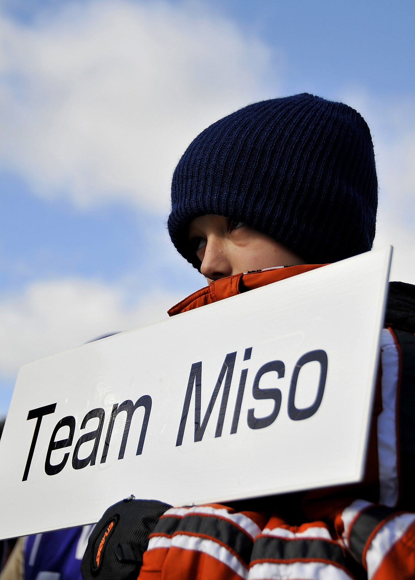 MISAWA AIR BASE, Japan -- James Pollock, age 10, holds his team's sign prior to taking the field during a snowball fight competition between Japanese and American children Feb. 14, 2009, in Misawa City. James Pollock is the son of Staff Sgt. James Pollock from the 373rd Intelligence Group. (U.S. Air Force photo by 2nd Lt. Jeffre Nagan)