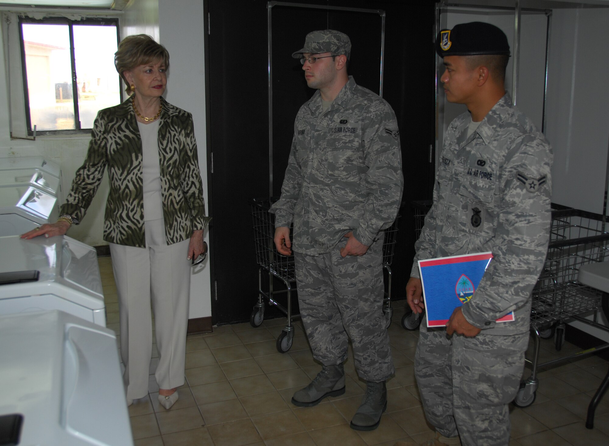 ANDERSEN AIR FORCE BASE, Guam - Congresswoman Madeliene Bordallo tours Tinian Hall with Airmen 1st Class Dominic Marino and Neil Carranza, from the 36th Force Support Squadron and 36th Security Forces Squadron respectively, Feb. 17. Twelve members of Congress received a first-hand look at the living conditions of Airmen on Andersen AFB, Guam. (U.S. Air Force photo by Senior Airman Shane Dunaway)
