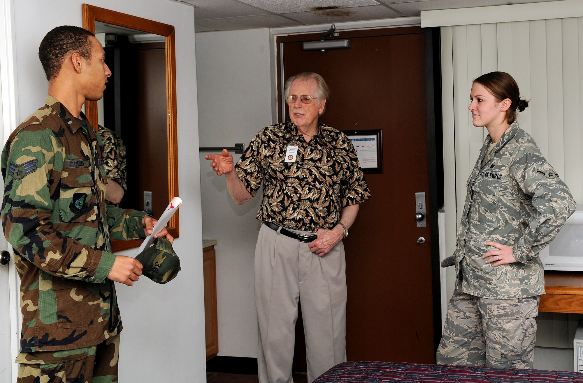 ANDERSEN AIR FORCE BASE, Guam - Mr. Roscoe Bartlett, U.S. Senator from Maryland, visits Senior Airman Brandon Gordon, 36th Communication Squadron, dormitory during the Congressional Delegation visit of Tinian Hall here Feb. 17. The Senators were briefed on future plans of the building before a walkthrough of the dorm. Twelve members of Congress toured Andersen as part of their Asia-Pacific itinerary that includes stops in Hawaii, South Korea, Okinawa, Japan and Iwo Jima. (U.S. Air Force photo by Airman 1st Class Courtney Witt)