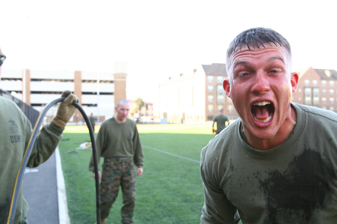 Staff Sgt. Andrew Langlois, Marine Security Guard School instructor, hollers after completing a nonlethal tactics course while enduring the burning sensation of oleoresin capsicum, or OC spray, at Marine Barracks Washington, Feb. 17.