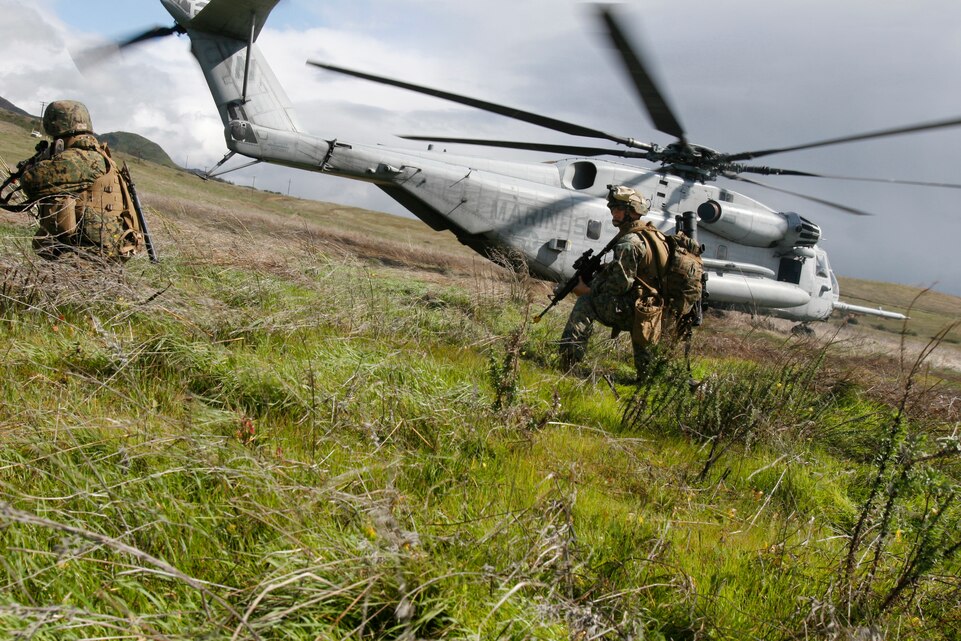 Marines with Company F, 2nd Battalion, 4th Marine Regiment begin a raid after being placed into position by helicopter Feb. 17. The raid was the first done as part of a training evolution here Feb. 16-20. Raids are unlike most operations that the infantry Marines conduct, in that they are supposed to attack a target and conduct a planned withdrawal, rather than occupy a position. The training was done in preparation for their upcoming deployment with the 11th Marine Expeditionary Unit later this year.