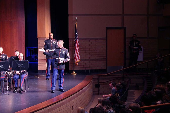 Staff Sgt. Jesse L. Barta, drum major, Marine Band San Diego, answers questions from students during a performance at Prior Lake High School. Fifty members of the U.S. Marine Corps Band San Diego recently performed at several high schools in the Twin Cities area as part of its annual tour.