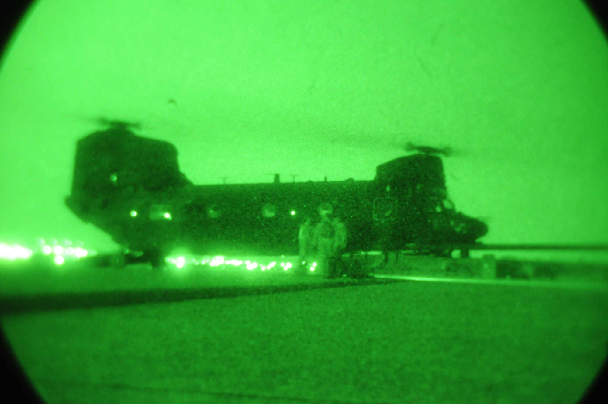 DAEGU AIR BASE, Republic of Korea -- Senior Airman Chad Jamerson, Staff Sgt. Timothy Haag and Master Sgt. Kirk Marcum, all from the 353rd Special Operations Group Forward Area Refueling Point Team, refuel a U.S. Army MH-47 helicopter from the 160th Special Operations Aviation Regiment (Airborne) at a forward area refueling point here Feb. 12. FARP specialists and loadmasters utilize a forward area manifold cart to transfer fuel from one aircraft to another in hostile and austere environments.  The group's seven member FARP team is one of five locations with an active FARP program; and covers the largest geographical area with almost 30 active FARP sites. (U.S. Air Force photo by Tech. Sgt. Aaron Cram)