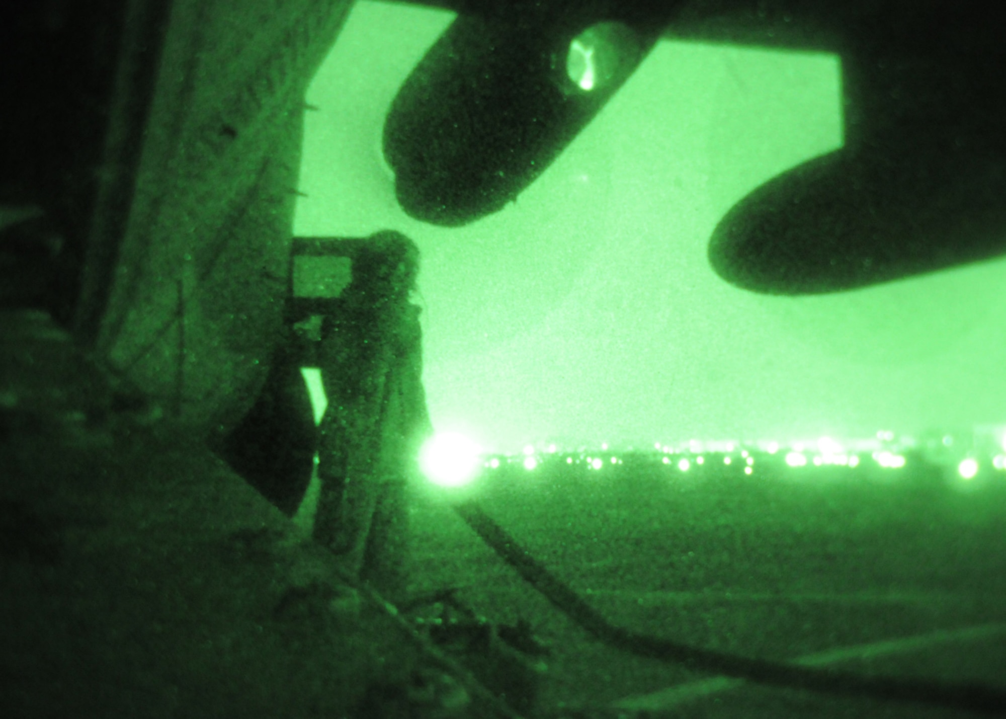 DAEGU AIR BASE, Republic of Korea -- Senior Airman Meagan Freeman, a 17th Special Operations Squadron loadmaster, monitors a fuel line connected to a MC-130P Combat Shadow during a refueling mission at a forward area refueling point here Feb. 12. FARP specialists and loadmasters utilize a forward area manifold cart to transfer fuel from one aircraft to another in hostile and austere environments.  Airman Freeman served as the panel operator for this mission and was responsible for connecting the hose to the MC-130P, configuring the panel to issue fuel to the FAM cart and monitor the panel throughout the operation. (U.S. Air Force photo by Tech. Sgt. Aaron Cram)