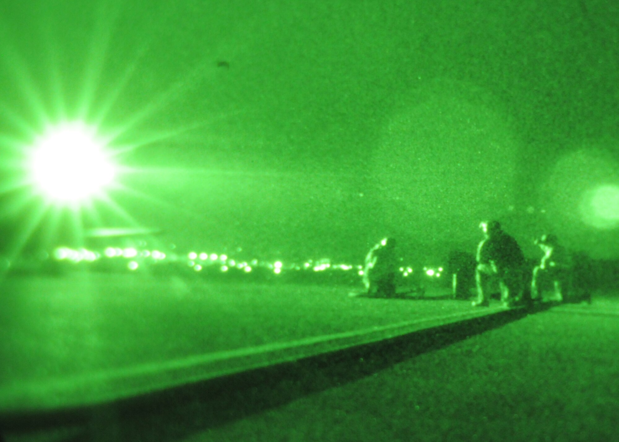 DAEGU AIR BASE, Republic of Korea -- Senior Airman Chad Jamerson, Staff Sgt. Timothy Haag and Master Sgt. Kirk Marcum, all from the 353rd Special Operations Group Forward Area Refueling Point Team, sit ready to refuel a U.S. Army MH-47 helicopter from the 160th Special Operations Aviation Regiment (Airborne) at a forward area refueling point here Feb. 12. Sixteen members from the 17th Special Operations Squadron, the 353rd Special Operations Group Forward Area Refueling Point Team, 353rd Maintenance Squadron and Detachment 3 of 25th Intelligence Squadron, conducted training in the Republic of Korea Feb. 9 - 12 to ensure they are ready to fulfill their duties as the only Air Force special operations unit permanently assigned in the U.S. Pacific Command theater. (U.S. Air Force photo by Tech. Sgt. Aaron Cram)