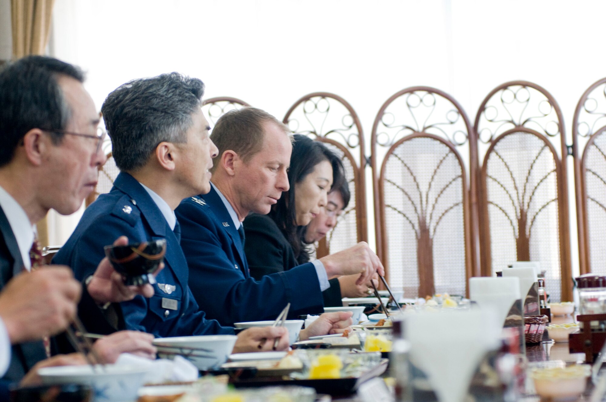 MISAWA AIR BASE, Japan -- Local mayors and military leaders share a traditional Japanese lunch in the Japan Air Self-Defense Force dining facility Feb. 10, 2009. Sharing a meal such as this gives the community leaders a more informal avenue for discussing current events and getting to know each other better. (U.S. Air Force photo by Staff Sgt. Samuel Morse)