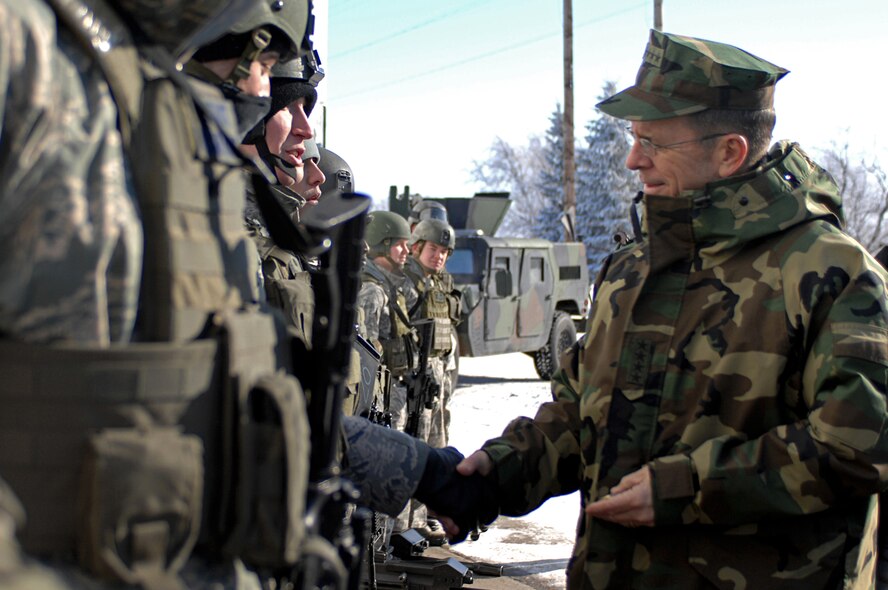 MINOT AIR FORCE BASE, N.D. – Navy Adm. Michael G. Mullen, chairman of the Joint Chiefs of Staff, shakes the hands of 91st Missile Wing Security Forces Airmen as he visits a simulated convoy of an Inner Continental Ballistic Missile here at Minot Air Force Base, Feb 18.  Braving the winter of North Dakota, he expressed his faith in the nuclear mission and his appreciation of the hard work that the Airmen were doing. Admiral Mullen is the first CJCS to visit Minot Air Force Base in over 20 years.  (U.S. Air Force photo by Senior Airman Kelly Timney)