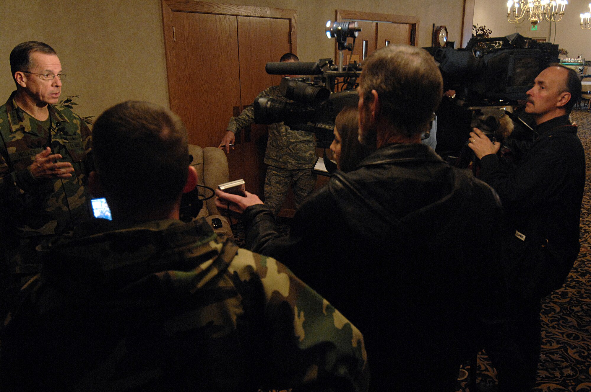 MINOT AIR FORCE BASE, N.D. -- Navy Adm. Michael G. Mullen, chairman of the Joint Chiefs of Staff, addresses local and national media during an interview at the Jimmy Doolittle Center, here Feb. 18. During his visit, Admiral Mullen talked with Airmen about the importance of family support, concerns over the economic crisis and Minot AFB’s role in nuclear deterrence as the Air Force’s only dual-wing, nuclear-capable base. Admiral Mullen is the first CJCS to visit the base in more than 20 years. (U.S. Air Force photo by Senior Airman Kelly Timney)