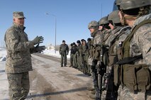 MINOT AIR FORCE BASE, N.D. -- Maj. Gen. Roger Burg, 20th Air Force commander, takes a break from his schedule of events during his visit and addresses members of the 91st Missile Security Forces Squadron here Feb. 18. The Airmen braved the cold in order to greet Navy Adm. Michael G. Mullen, chairman of the Joint Chiefs of Staff, and General Burg during their visit. (U.S. Air Force photo by: SrA Kelly Timney)