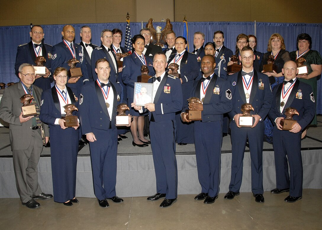 82nd Training Wing annual award winners show off their awards Feb. 13 with 82nd Training Wing Commander Brig. Gen. O.G. Mannon and 82nd TRW Command Chief Master Sgt. Kenneth Sallinger during the Annual Awards Banquet at the Multi Purpose Event Center. (U.S. Air Force photo/Lou Anne Sledge) 
