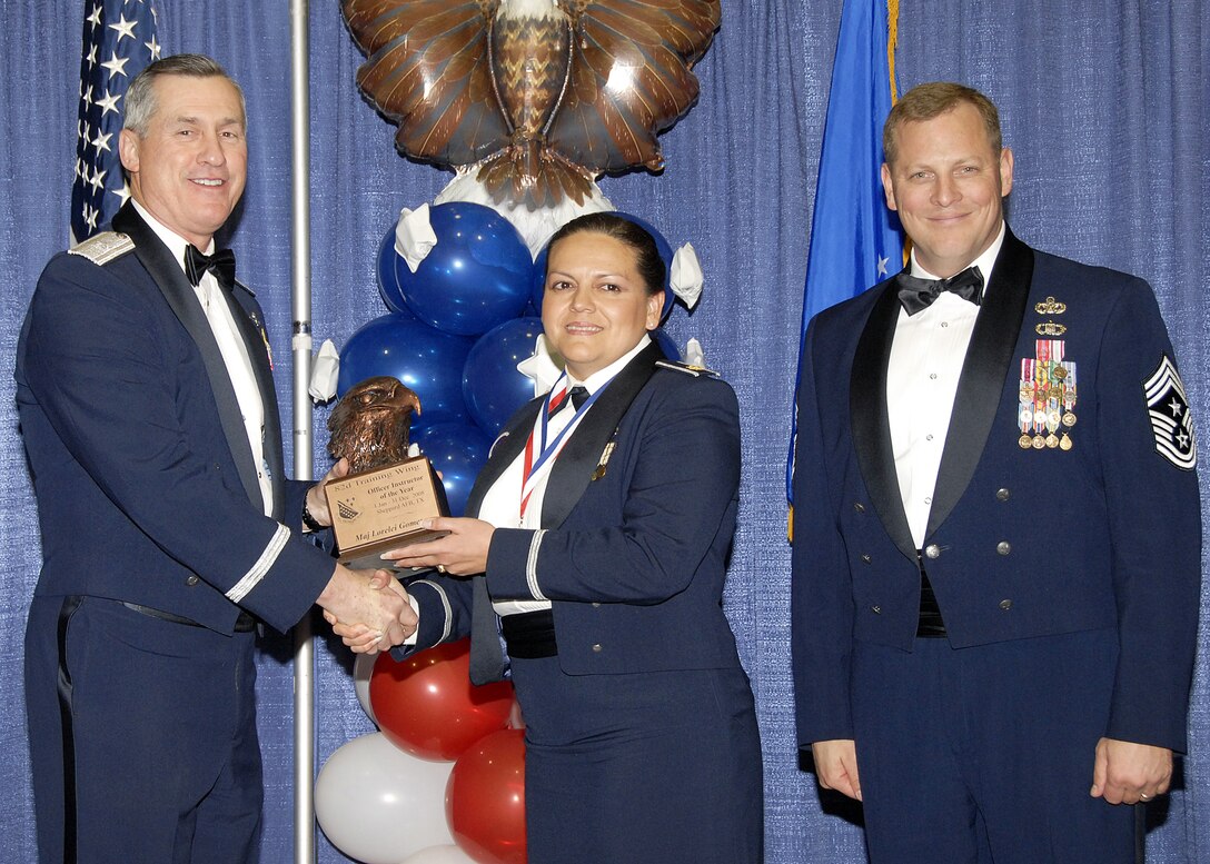 Maj. Lorelei Gomez, 82nd Training Group, accepts the Officer Instructor of the Year award on Feb. 13 from 82nd Training Wing Commander Brig. Gen. O.G. Mannon during the Annual Awards Banquet at the Multi Purpose Event Center. Also pictured is 82nd TRW Command Chief Master Sgt. Kenneth Sallinger. (U.S. Air Force photo/Lou Anne Sledge) 