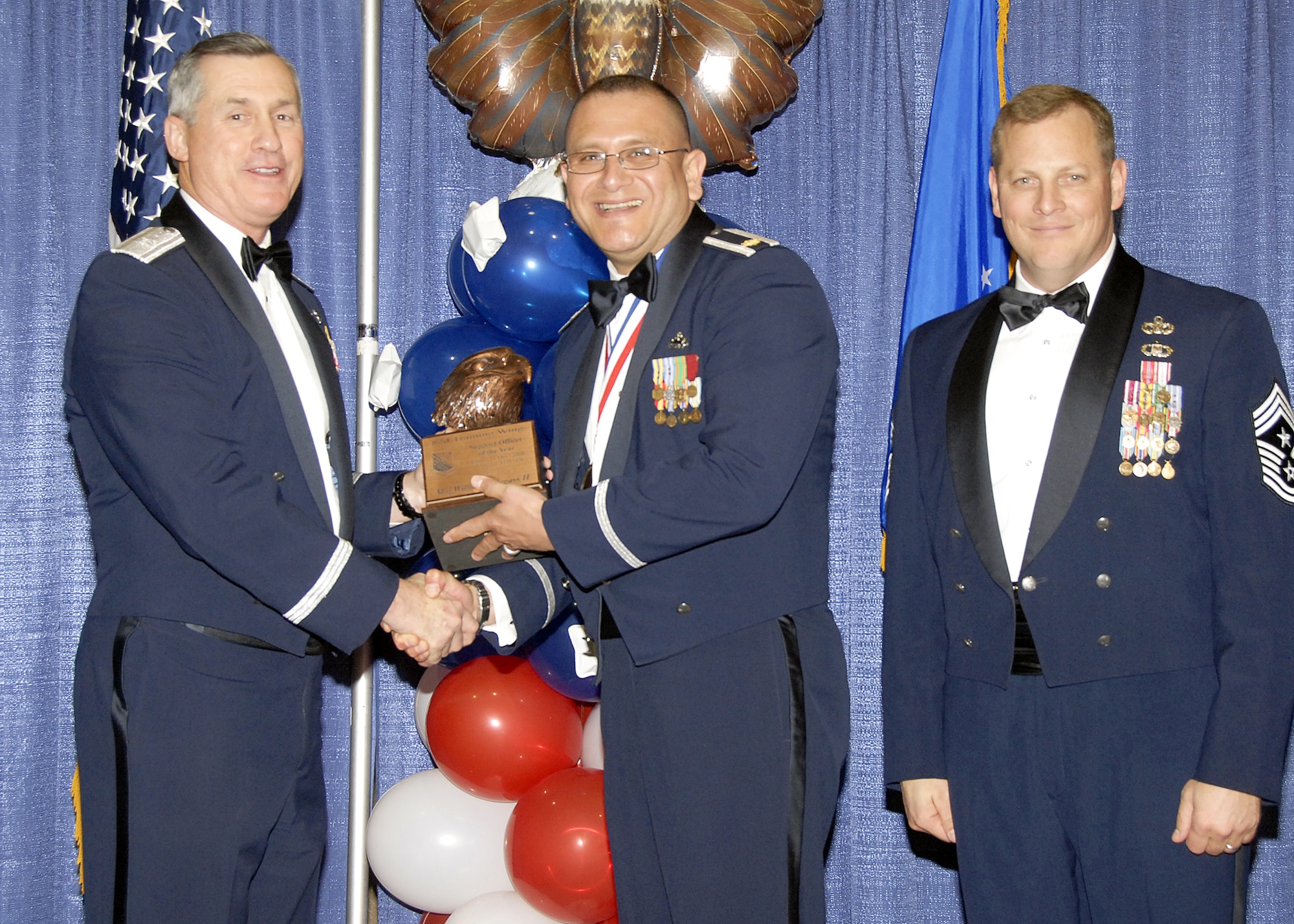 Maj. William Villegas II, 982nd Mission Group, accepts the Support Officer of the Year award on Feb. 13 from 82nd Training Wing Commander Brig. Gen. O.G. Mannon during the Annual Awards Banquet at the Multi Purpose Event Center. Also pictured is 82nd TRW Command Chief Master Sgt. Kenneth Sallinger. (U.S. Air Force photo/Lou Anne Sledge) 