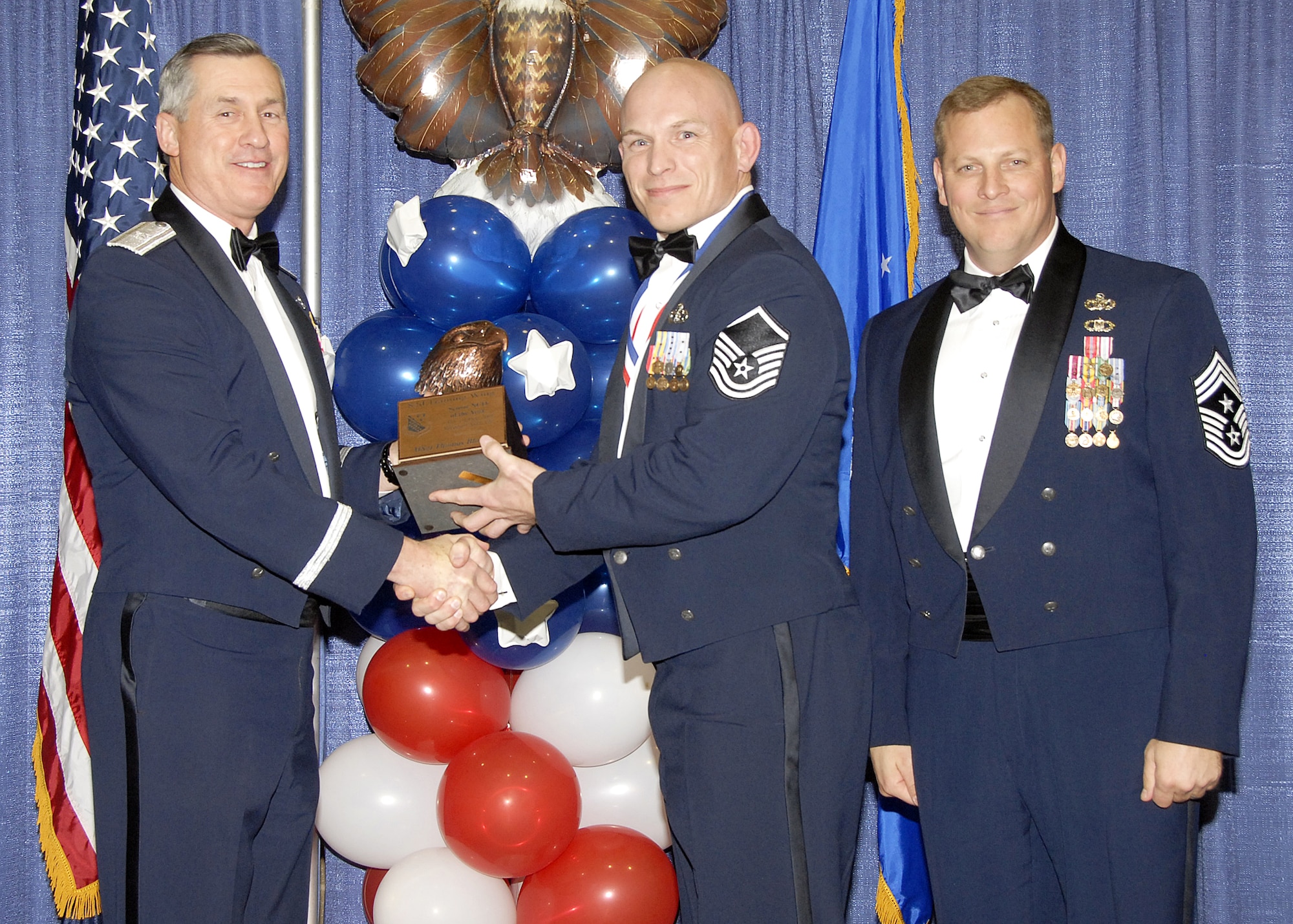 Master Sgt. Thomas Blount, 782nd Training Group, accepts the Senior NCO of the Year award on Feb. 13 from 82nd Training Wing Commander Brig. Gen. O.G. Mannon during the Annual Awards Banquet at the Multi Purpose Event Center. Also pictured is 82nd TRW Command Chief Master Sgt. Kenneth Sallinger. (U.S. Air Force photo/Lou Anne Sledge) 