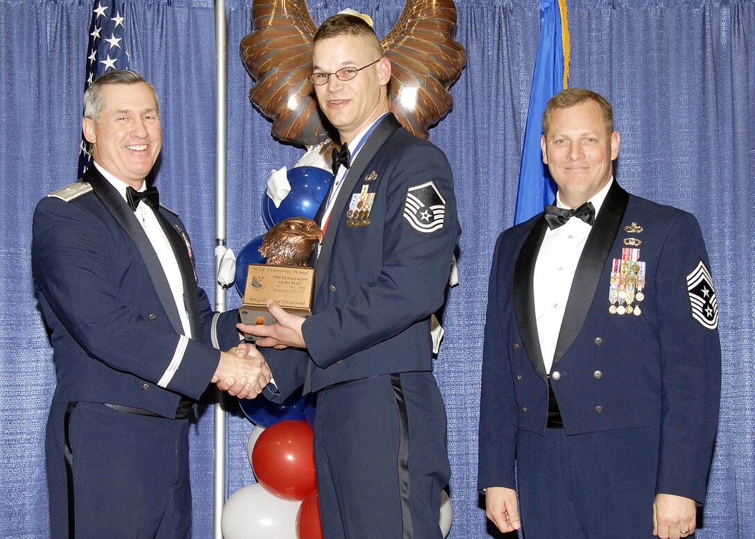Master Sgt. Edward Fitzgerald, 782nd Training Group, accepts the Senior NCO Instructor of the Year award on Feb. 13 from 82nd Training Wing Commander Brig. Gen. O.G. Mannon during the Annual Awards Banquet at the Multi Purpose Event Center. Also pictured is 82nd TRW Command Chief Master Sgt. Kenneth Sallinger. (U.S. Air Force photo/Lou Anne Sledge) 