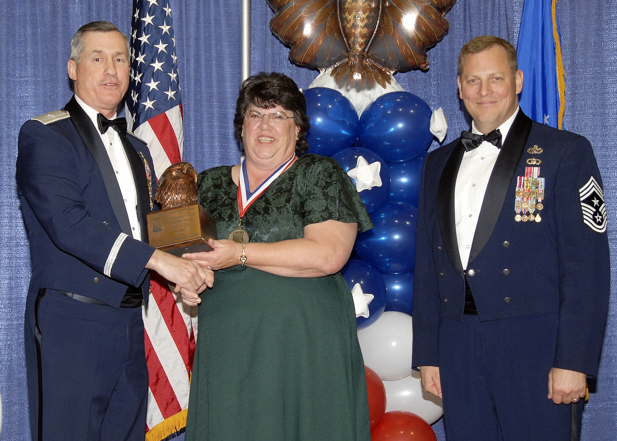 Mrs. Carol Blankenship, 82nd Training Group, accepts the Support Civilian of the Year, award on Feb. 13 from 82nd Training Wing Commander Brig. Gen. O.G. Mannon during the Annual Awards Banquet at the Multi Purpose Event Center. Also pictured is 82nd TRW Command Chief Master Sgt. Kenneth Sallinger. (U.S. Air Force photo/Lou Anne Sledge) 