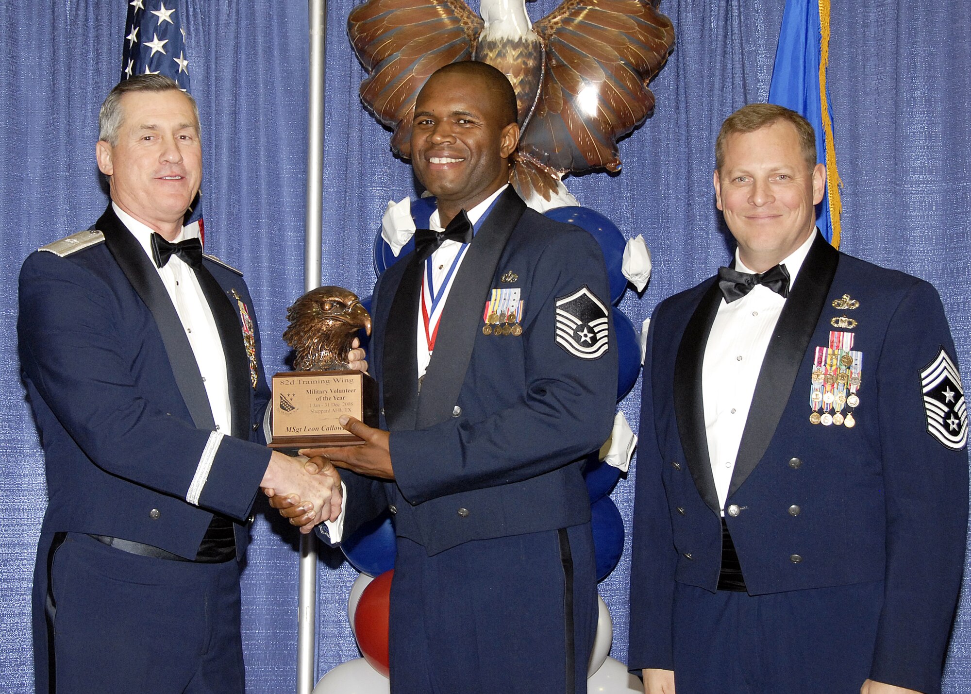 Master Sgt. Leon Calloway, 782nd Training Group, accepts the Military Volunteer of the Year award on Feb. 13 from 82nd Training Wing Commander Brig. Gen. O.G. Mannon during the Annual Awards Banquet at the Multi Purpose Event Center. Also pictured is 82nd Training Wing Command Chief Master Sgt. Kenneth Sallinger. (U.S. Air Force photo/Lou Anne Sledge) 