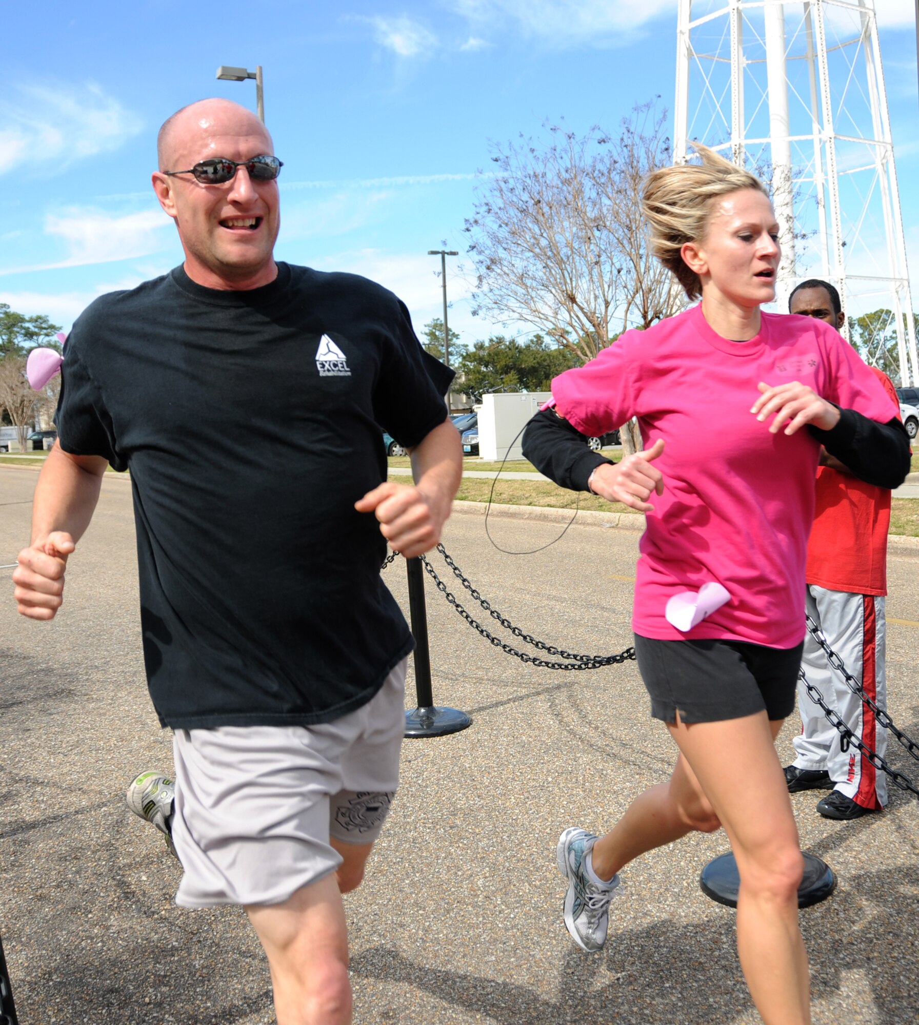 Matthew Benton, 81st Medical Group, and Michelle Sprague, wife of Anthony Sprague, 336th Training Squadron, are the winners of the Sweetheart Run, Feb. 12.  The first male and female couple to cross the finish line of the 5-kilometer race wins the annual event which starts and finishes at Blake Fitness Center.  (U.S. Air Force photo by Kemberly Groue)