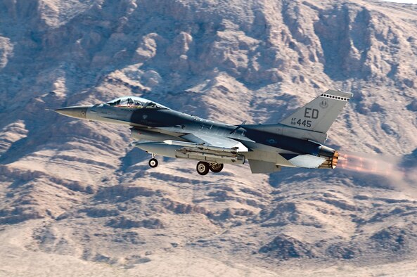 An Edwards F-16 Fighting Falcon flies over the vast bombing and gunnery ranges of Nellis Air Force Base, Nev., as part of Red Flag from Jan. 26 to Feb. 6. This marked the first time an Air Force Materiel Command unit has ever deployed and participated in the exercise. (Photo by John Mumaw)