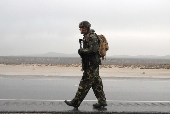 Senior Airman Bradley Grupenhagen, 95th Security Forces Squadron patrolman, walks along Rosamond Boulevard as part of a 9.1-mile Joyner Invitational Feb. 16. (Air Force photo by Senior Airman Julius Delos Reyes)