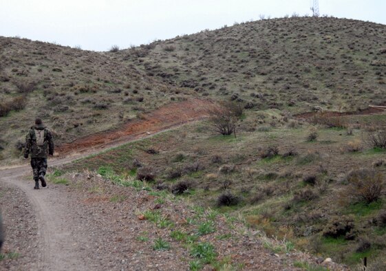 A 95th Security Forces Squadron Airman treks Red Hill during the 2nd Joyner Invitational Feb. 16. The 95th SFS hosted a 9.1-mile march from the West Gate to the Red Hill. (Air Force photo by Senior Airman Julius Delos Reyes)