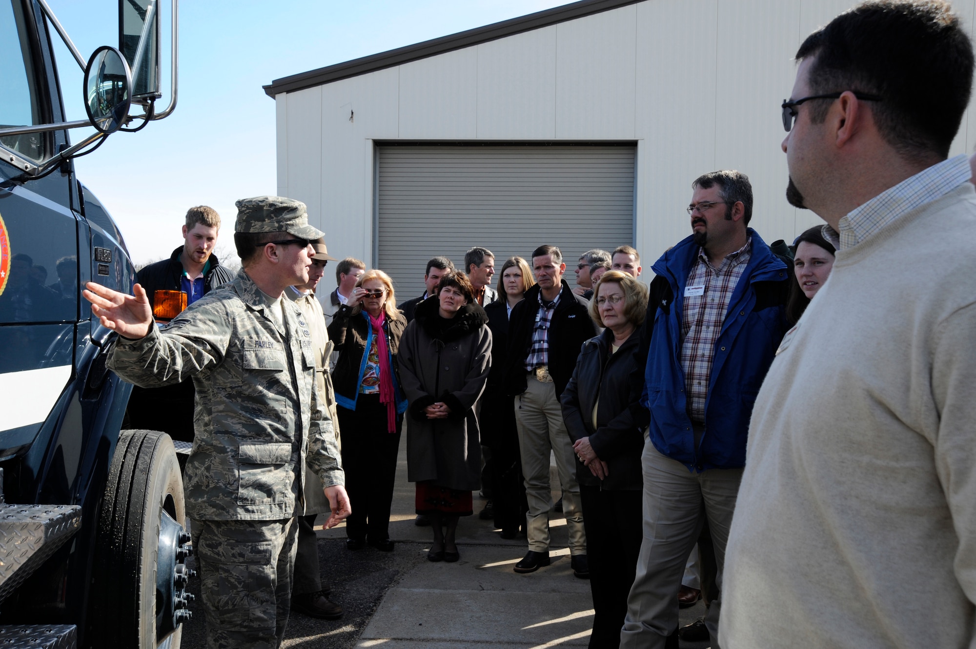 MCCONNELL AIR FORCE BASE, Kan. -- Senior Airman Eric Farley, 22nd Explosive Ordinance Disposal, briefs the Kansas Agricultural and Rural Leadership group, Feb. 12, on his shop’s Base Support Emergency Reserve Vehicle which allows them to detonate, retrieve or search for bombs from long distances. The Kansas Agricultural and Rural Leadership group toured McConnell Air Force Base in an effort to gain a better understanding of McConnell’s mission. (Photo by Senior Airman Laura Suttles)