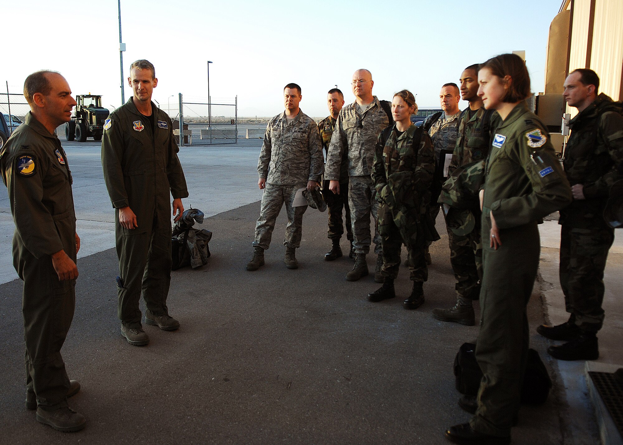 49th Fighter Wing commander, Col. Jeff Harrigian, greets members assigned to the 3rd Maintenance Group, Elmendorf Air Force Base, Alaska, on Feb. 17. Personnel and aircraft assigned to the 3rd Maintenance Group will stay at Holloman Air Force Base, N.M., until the volcanic activity observed at Mount Redoubt near Elmendorf subsides.

 (U.S. Air Force photo/SSgt Anthony Nelson Jr)