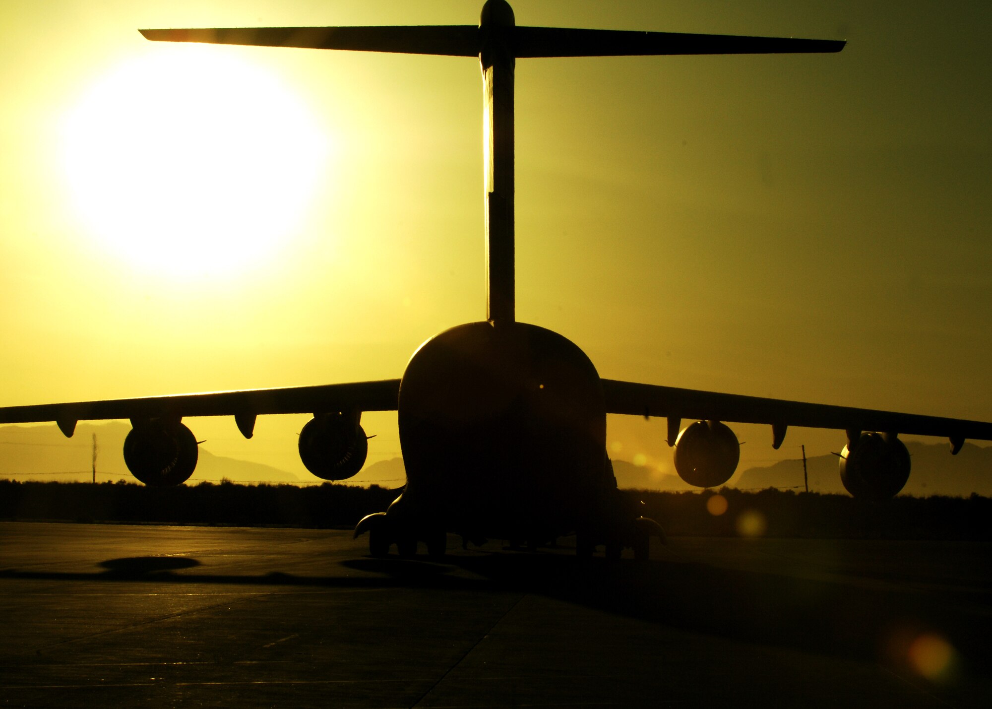 A C-17 sits on the ramp Feb. 17, next to Holloman Air Force Base's Basic Expeditionary Airfield Resources (BEAR) base. The C-17 is from Elmendorf AFB, Alaska, personnel and aircraft assigned to the 3rd Maintenance Group will stay at Holloman until the volcanic activity observed at Mount Redoubt near Elmendorf subsides. (U.S. Air Force photo/SSgt Anthony Nelson Jr)