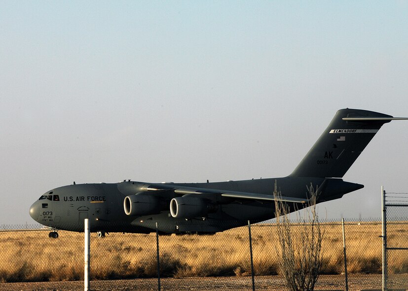 A C-17 from Elmendorf AFB, Alaska, touches down at Holloman Air Force Base, N.M., Feb. 17. Personnel and aircraft assigned to the 3rd Maintenance Group will stay at Holloman until the volcanic activity observed at Mount Redoubt near Elmendorf subsides. (U.S. Air Force photo/SSgt Anthony Nelson Jr)