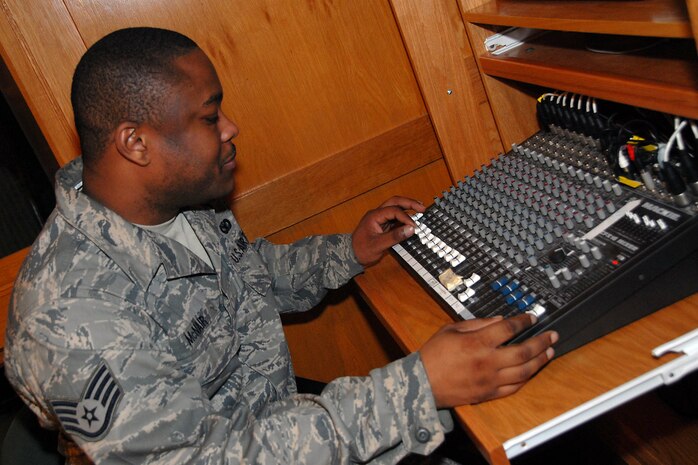Staff Sgt. Mitchell McNair adjusts the sound system in the base chapel prior to a religious service Feb. 14. There are seven religious services held weekly at the base chapel drawing approximately 400 worshippers each week. Sergeant McNair is a chaplain assistant with the 437th Airlift Wing. (U.S. Air Force photo/Airman 1st Class Melissa White)