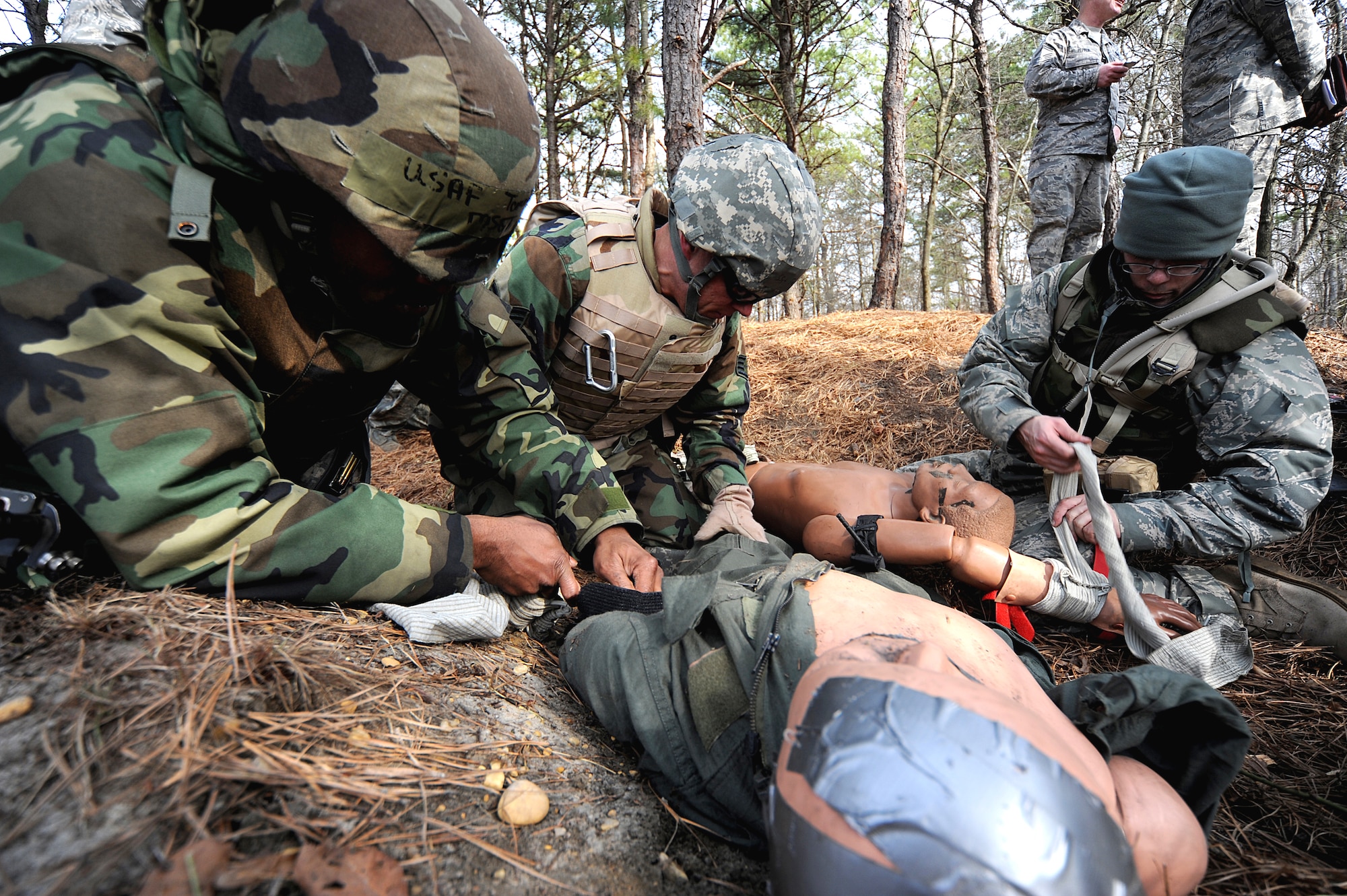 Students in the Advanced Contingency Skills Training Course participate in a scenario for combat first aid training on Feb. 10, 2009, on a Fort Dix, N.J., range.  The course, taught by the U.S. Air Force Expeditionary Center's 421st Combat Training Squadron, prepares Airmen for upcoming deployments through training in everything from combat first aid and convoy operations to patrolling and tactics.  (U.S. Air Force Photo/Staff Sgt. Nathan G. Bevier)