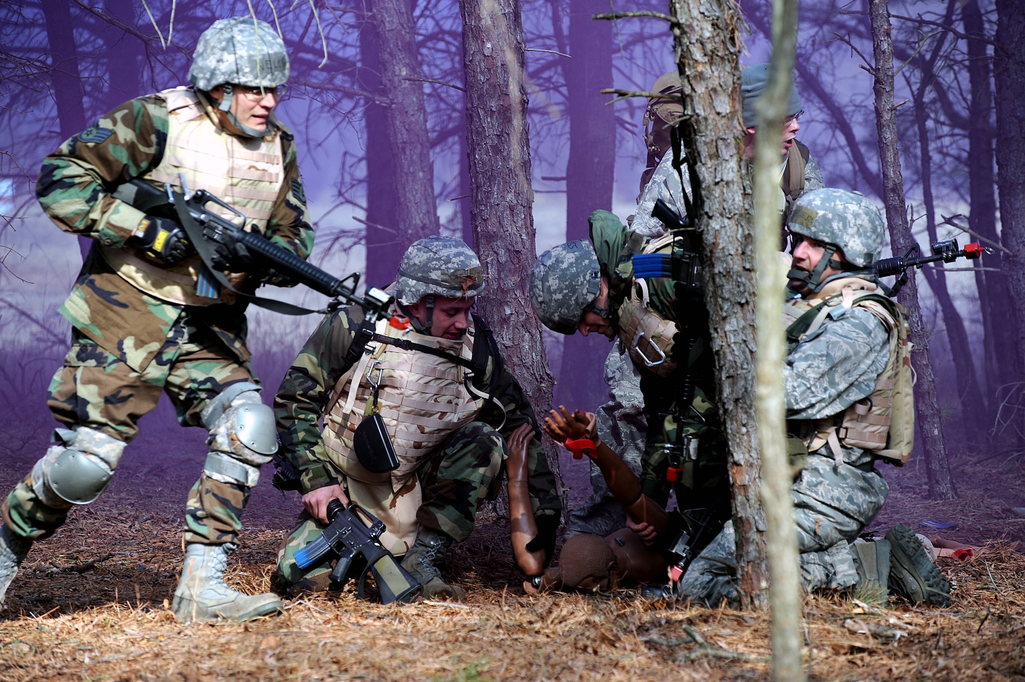 Students in the Advanced Contingency Skills Training Course participate in a scenario for combat first aid training on Feb. 10, 2009, on a Fort Dix, N.J., range.  The course, taught by the U.S. Air Force Expeditionary Center's 421st Combat Training Squadron, prepares Airmen for upcoming deployments through training in everything from combat first aid and convoy operations to patrolling and tactics.  (U.S. Air Force Photo/Staff Sgt. Nathan G. Bevier)
