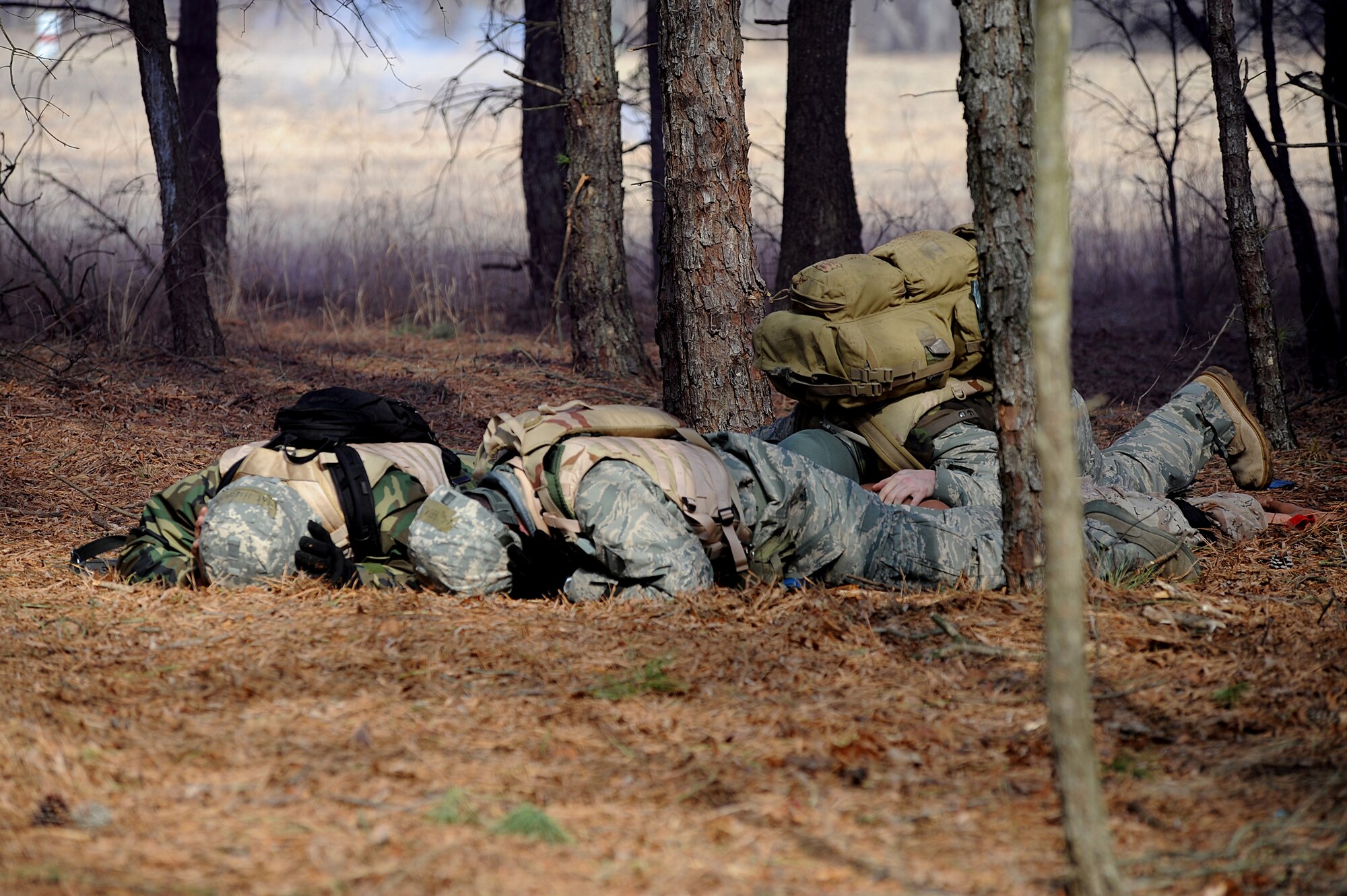 Students in the Advanced Contingency Skills Training Course participate in a scenario for combat first aid training on Feb. 10, 2009, on a Fort Dix, N.J., range.  The course, taught by the U.S. Air Force Expeditionary Center's 421st Combat Training Squadron, prepares Airmen for upcoming deployments through training in everything from combat first aid and convoy operations to patrolling and tactics.  (U.S. Air Force Photo/Staff Sgt. Nathan G. Bevier)