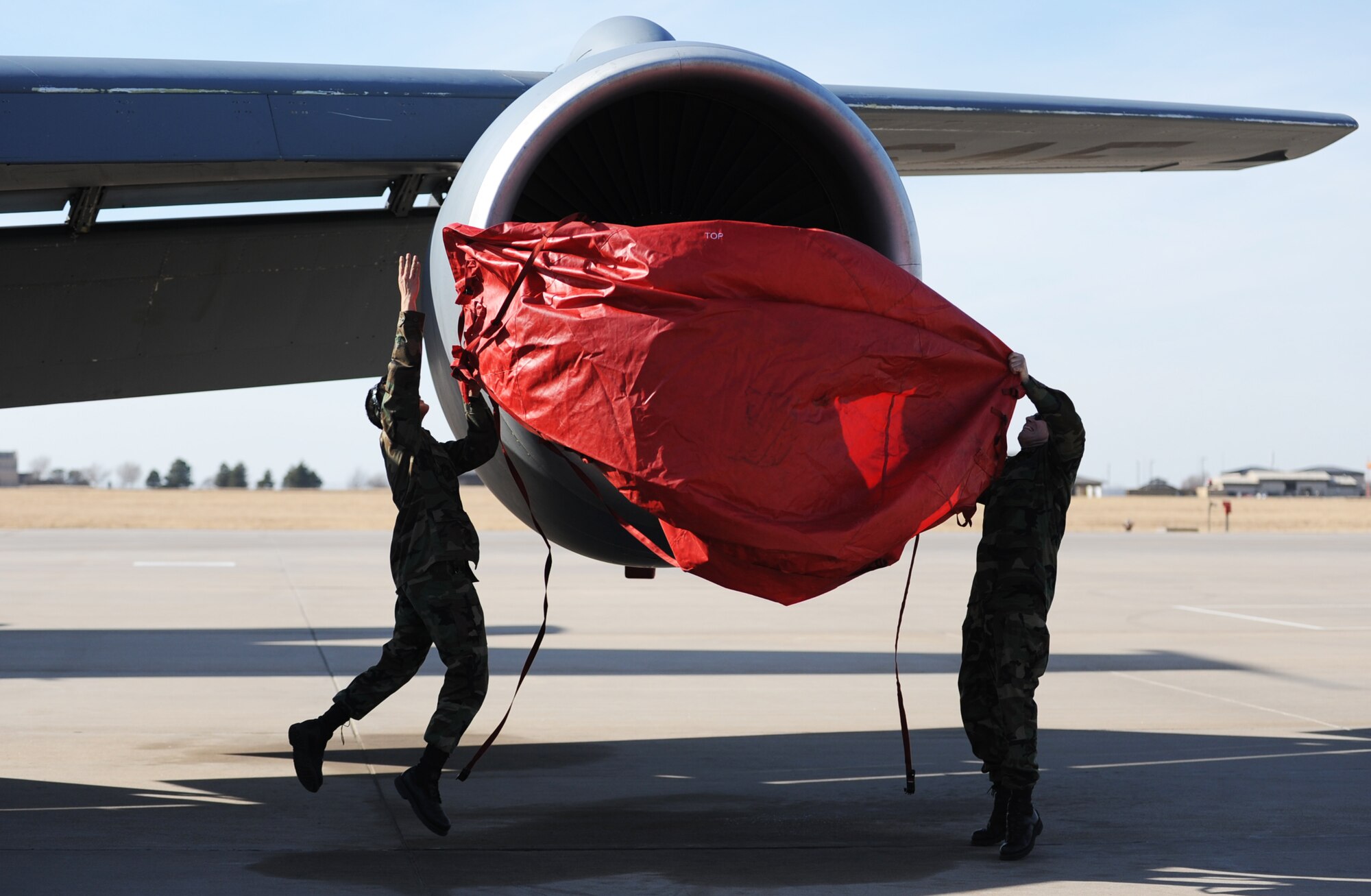 Senior Airman Joseph Hong (on left) and Tech. Sgt. Lanning Pike work together on the placement of a KC-135 Stratotanker engine cover during the 931st Air Refueling Group's drill weekend in February. Both Airmen are assigned to the 931st Aircraft Maintenance Squadron. The 931st ARG is an Air Force Reserve unit at McConnell Air Force Base, Kan. (U.S. Air Force photo/Tech. Sgt. Jason Schaap)