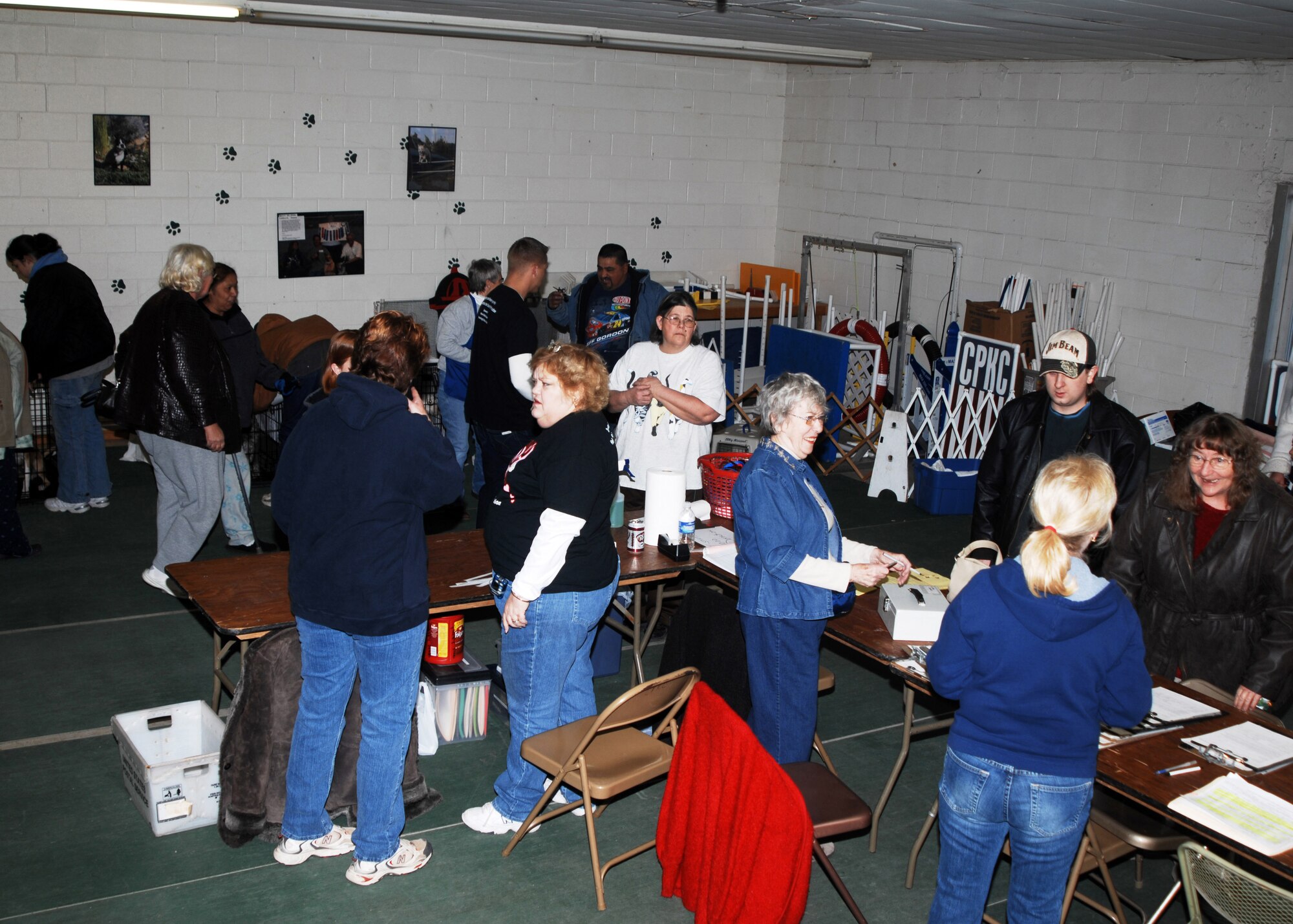 CANNON AIR FORCE BASE, N.M. -- Clovis, N.M., residents and base Airmen gather at Rewards Dog Obedience School in Clovis to take advantage of low-cost services provided by the Santa Fe, N.M., Animal Shelter and Humane Society on Feb. 15. Volunteers from the shelter spent three days in Clovis providing neutering, spaying , and vaccinations for $20. (Air Force photo by Greg Allen)