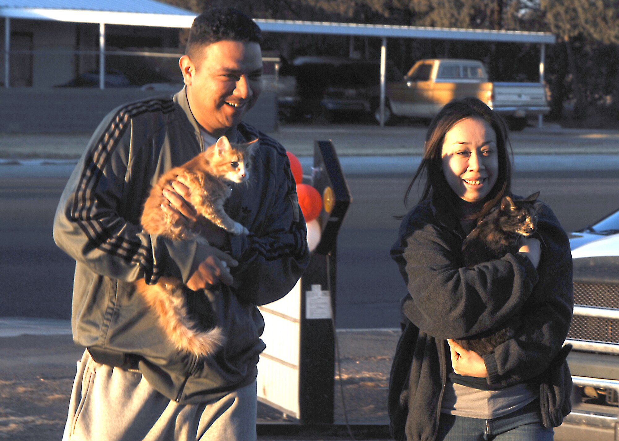 CANNON AIR FORCE BASE, N.M.--  Staff Sgt. Luis Mejia, 27th Special Operations Aircraft Maintenance Squadron, and his wife Alex, bring in their two cats to be spayed by volunteer veterinarians from the Santa Fe, N.M., Shelter and Humane Society on Feb. 15. The organization came to Clovis Feb. 13-15 to provide low-cost ($20) spaying and neutering services made available to Clovis residents and Cannon Airmen. (Air Force photo by Greg Allen) 