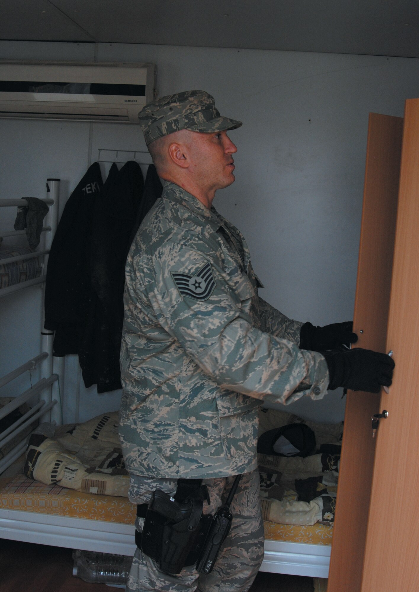 WRIGHT-PATTERSON AFB, Ohio – Tech Sgt. Michael Carley, deployed with the 445th Airlift Wing Security Forces Squadron, performs a search as part of deployed security duties. Eighteen members from the squadron left here for Southwest Asia Dec. 20, and 13 more departed Jan 23. The reservists will be deployed for six months in support of ongoing security operations. (Courtesy photo) 