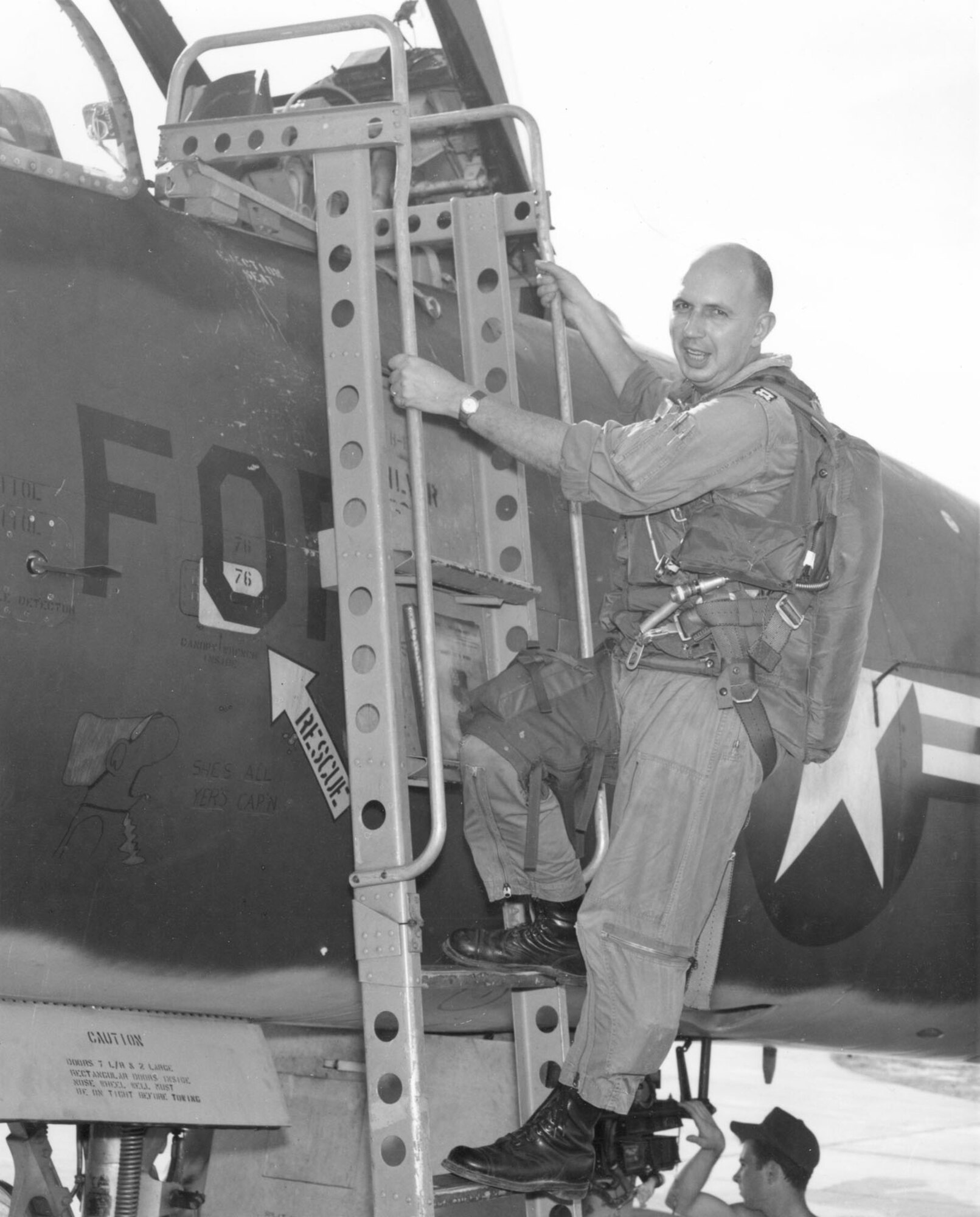 Capt. Donald Beck getting out of his RF-101C after flying his 100th “counter” on Nov. 15, 1965. (U.S. Air Force photo)