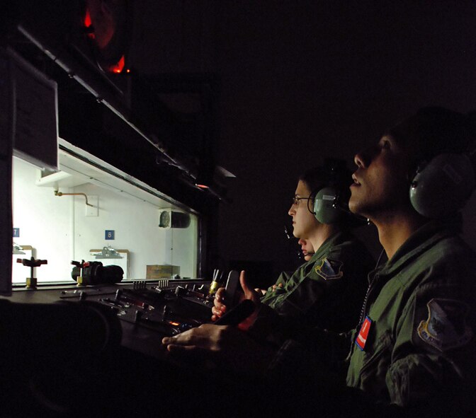 LAUGHLIN AIR FORCE BASE, Texas – Airman 1st Class Francis Nacapuy and 2nd Lt. Heather Tevebaugh, 47th Aerospace Physiology Unit, pays close attention to the controls on the hyperbaric chamber as the APU begins filming a portion of a new training video here recently. (U.S. Air Force photo by Airman 1st Class Sara Csurilla)