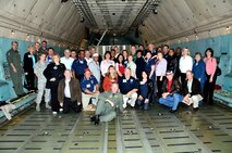 Thirty five civic leaders along with Col. William Binger, 482nd Fighter Wing commander, and aircrew members pause for a group picture inside a C-5 Galaxy transport aircraft during a civic leader tour on Feb 13. The influential leaders from the Miami area boarded a KC-135 Stratotanker for a two-day “Civic Leader Flight” to Keesler AFB, Miss., and Lackland AFB, Texas, on Feb. 12-13. The group witnessed F-16’s from the 93rd Fighter Squadron flying up to the KC-135 for an aerial refueling training mission on their way to Mississippi. While at Keesler, the group received briefings and tours of the famed Hurricane Hunter aircraft. On Friday, the civic leaders viewed a Basic Military Training graduation parade and toured a C-5 Galaxy transport aircraft and simulator facility. (U.S. Air Force photo/Tim Norton)