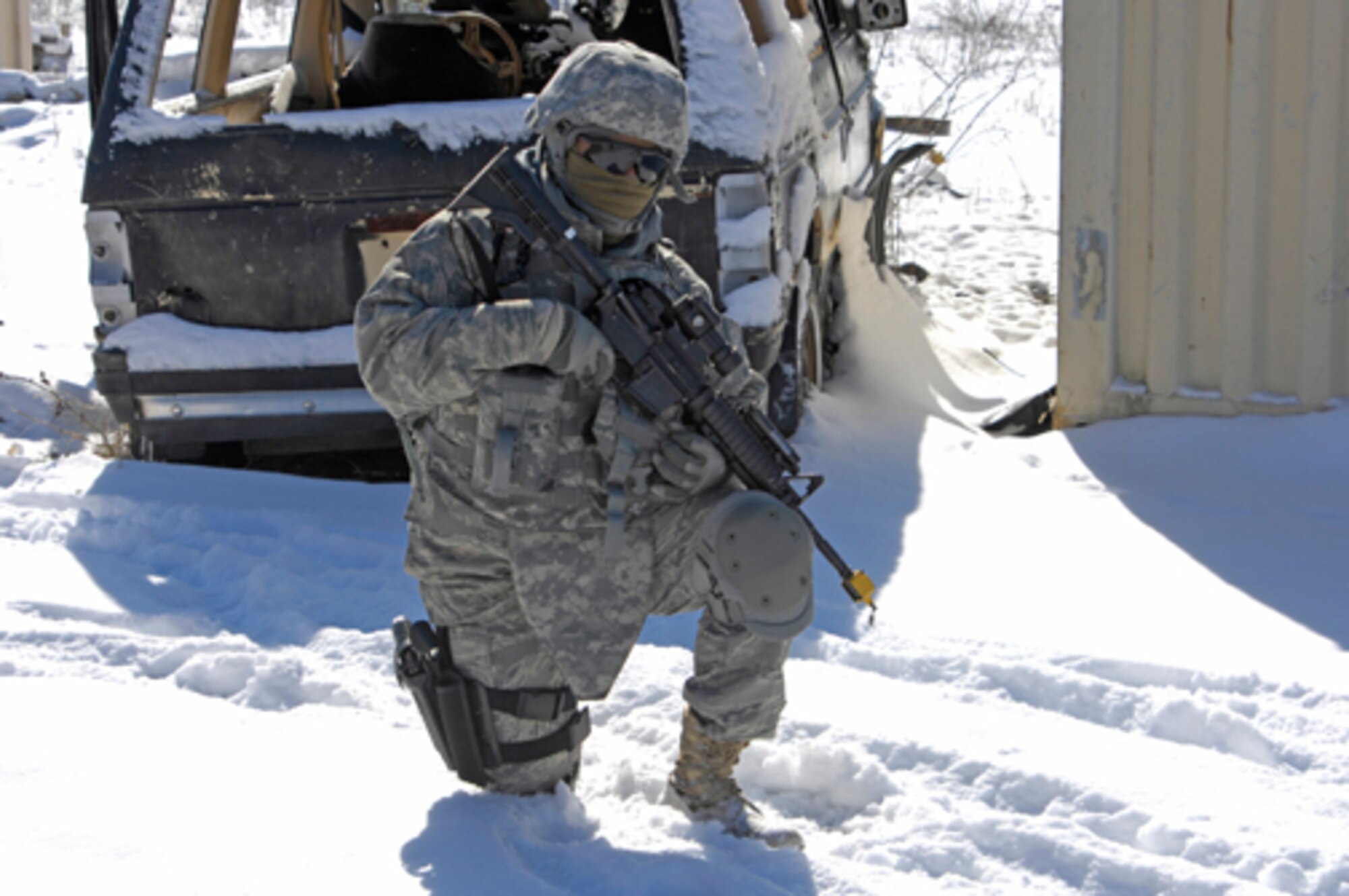 Senior Airman Cassie Castillo kneels in position during recent training at Fort Dix. The Alpha 6 Squadron trained in meeting and talking with Iraqi officials on the coldest day of the year at Fort Dix with a temperature around 10 degrees. (U.S. Army photo/Lisa Evans) 