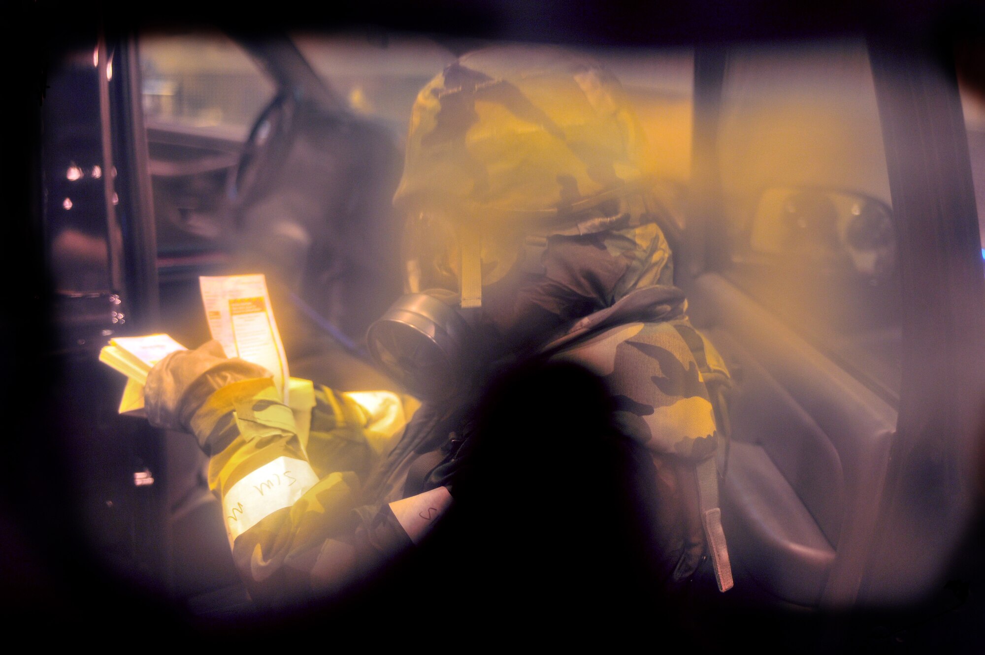 An Airman from the 354th Fighter Wing refers to her Airmans Manual during the Ability to Survive and Operate training Feb. 12, 2009 at Eielson Air Force Base, Alaska. ATSO training is implemented to maintain readiness in the event of a chemical, biological, nuclear, or high explosive attack. (U.S. Air Force photo/Airman 1st Class Willard E. Grande II)
