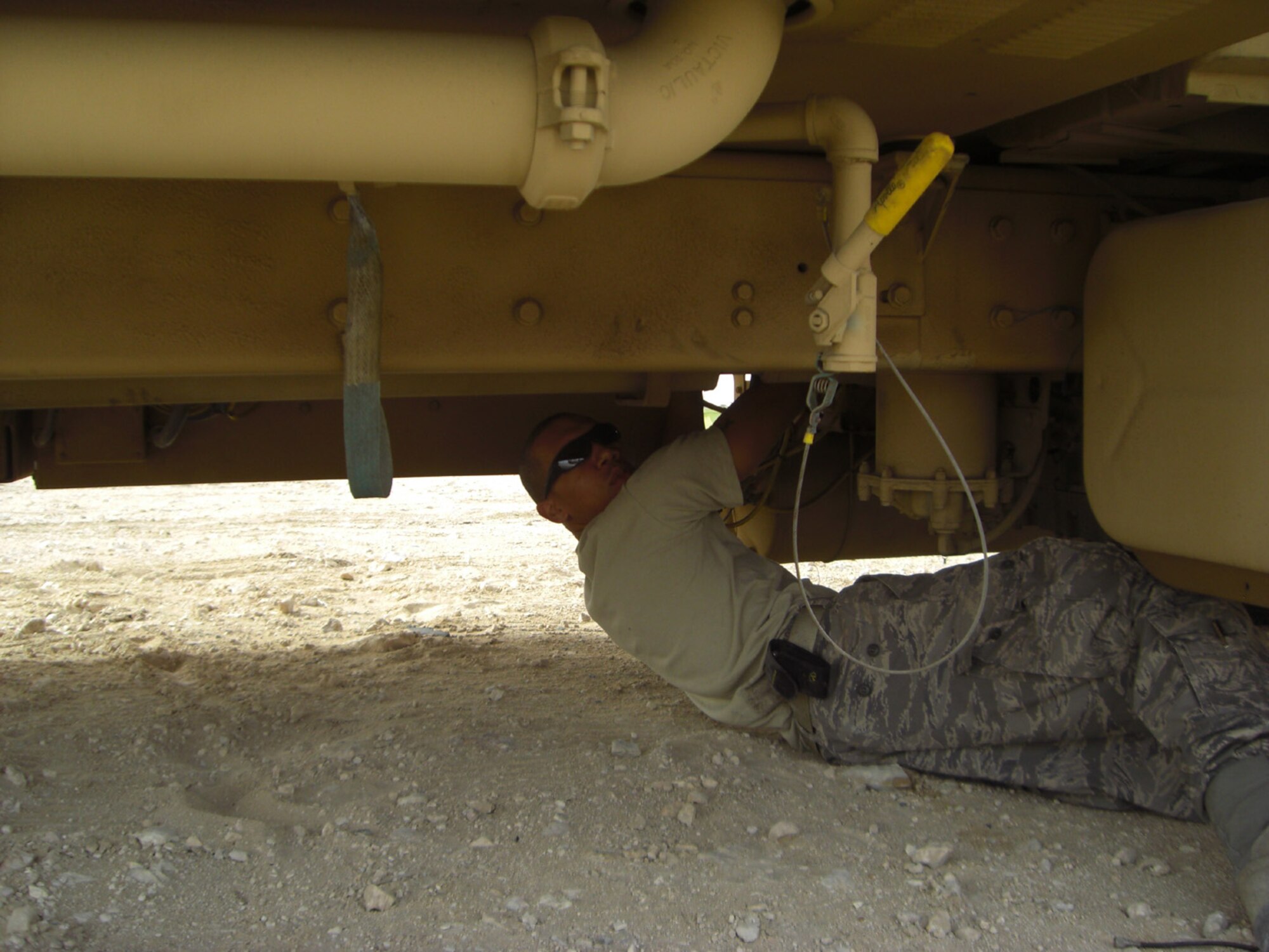 SEYMOUR JOHNSON AIR FORCE BASE, N.C. -- Airman First Class Christopher Twitty installs a mobile radio in a jet fuel truck while stationed in Al Udeid, Qatar. Airman Twitty is a Reservist with the 916th Communication Squadron.